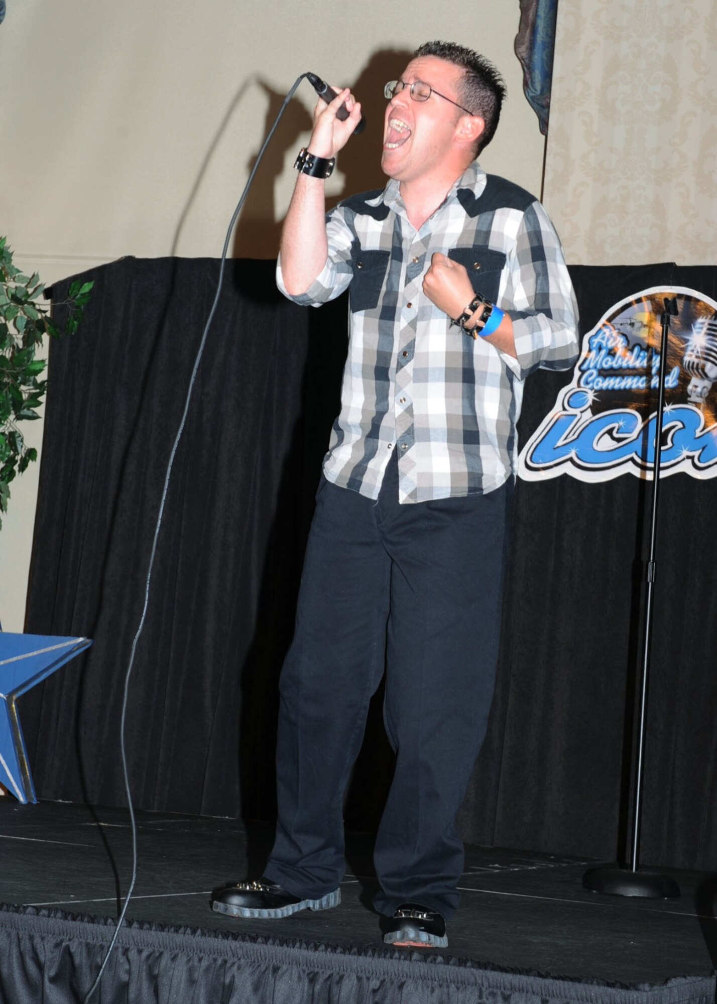 SCOTT AIR FORCE BASE, Ill. -- Staff Sgt. Rick Blisch sings "Faithfully," by Journey. Sergeant Blisch was the active duty winner of 11 contestants who will go onto compete in the AMC-Wide final competition at the Scott Club Oct. 22.  (U.S. Air Force photo/ Tech. Sgt. Michelle Larche)