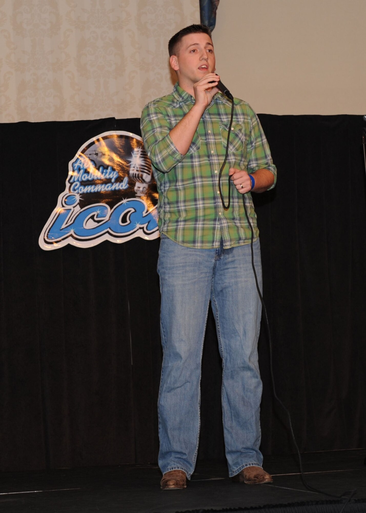 SCOTT AIR FORCE BASE, Ill. -- 2nd Lt. Zach Spotts sings "Unanswered Prayers" by Garth Brooks during the AMC Icon competition at the Scott Club. (U.S. Air Force photo/ Tech. Sgt. Michelle Larche)