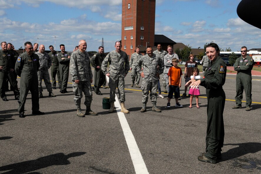 RAF MILDENHALL, England -- Col. Eden J. Murrie, 100th Air Refueling Wing Commander, says a few words while dripping wet at the end of her fini-flight Aug. 27.  Colonel Murrie is completing her time as commander here, a position she has held since 2007.  (U.S. Air Force photo by Staff Sgt. Christopher L. Ingersoll)