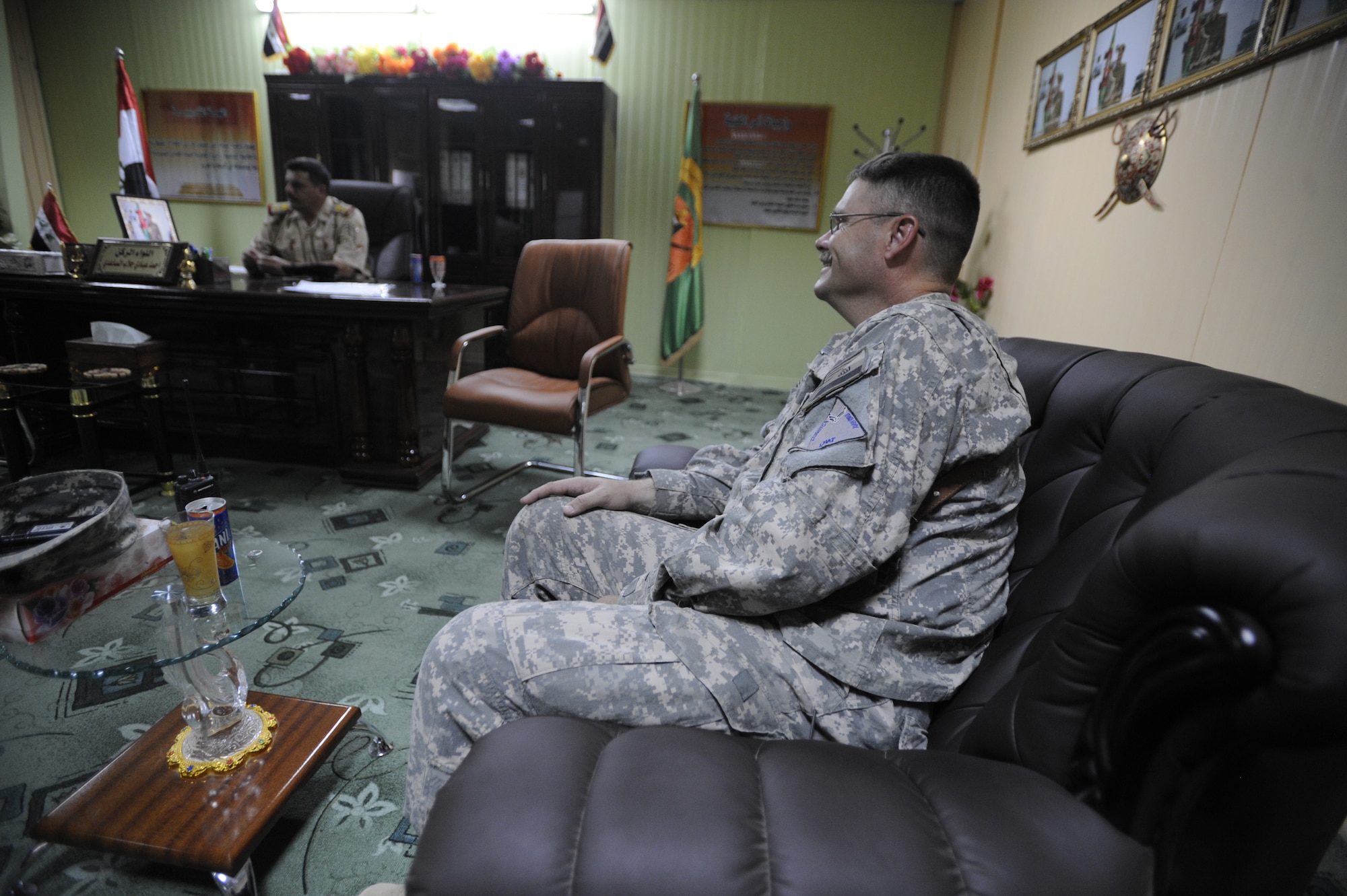 ALI BASE, Iraq - U.S. Air Force Lt. Col. Steven Ramsay, Logistics Military Advisory Team (LMAT) Senior Advisor, speaks with the Commander of the Officer Training School located on Camp Ur, an Iraqi military base Aug. 17, 2009.  Colonel Ramsay, deployed from Keesler Air Force Base, Miss., and his team advise the Iraqi military in base operations. (U.S. Air Force photo / Staff Sgt. Shawn Weismiller)