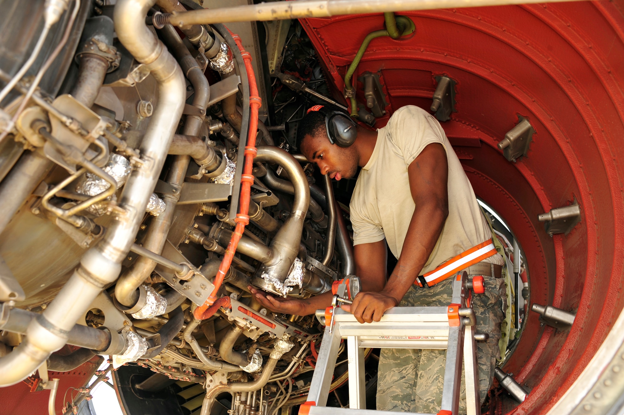 SOUTHWEST ASIA -Airman 1st Class Mareguis Killebrew, 380th Expeditionary
Maintenance Squadron, checks for leaks on a KC-10 Extender engine Aug. 29,
2009. Airman Killebrew is deployed from Travis Air Force Base, Calif., and
grew up in Savannah, Ga. (U.S. Air Force photo/Tech. Sgt. Charles Larkin Sr)
