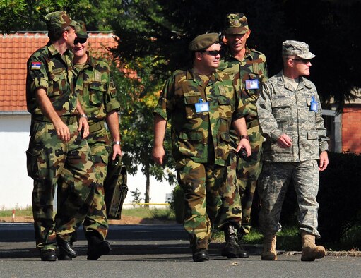 U.S. Air Force Col. Tim Brown (right), 435th Expeditionary Air Ground Operations Group commander, receives a tour of the Knez Mihailo Barracks grounds in Nis, Serbia, from a group of Serbian Armed Forces officers Aug. 29, 2009.  Colonel Brown, along with 31 fellow 435th Air Ground Operations Wing members, deployed to Serbia for two weeks in support of the Medical Training Exercise in Central and Eastern Europe 2009, better known as MEDCEUR 2009. (U.S. Air Force photo by Staff Sgt. Markus M. Maier)