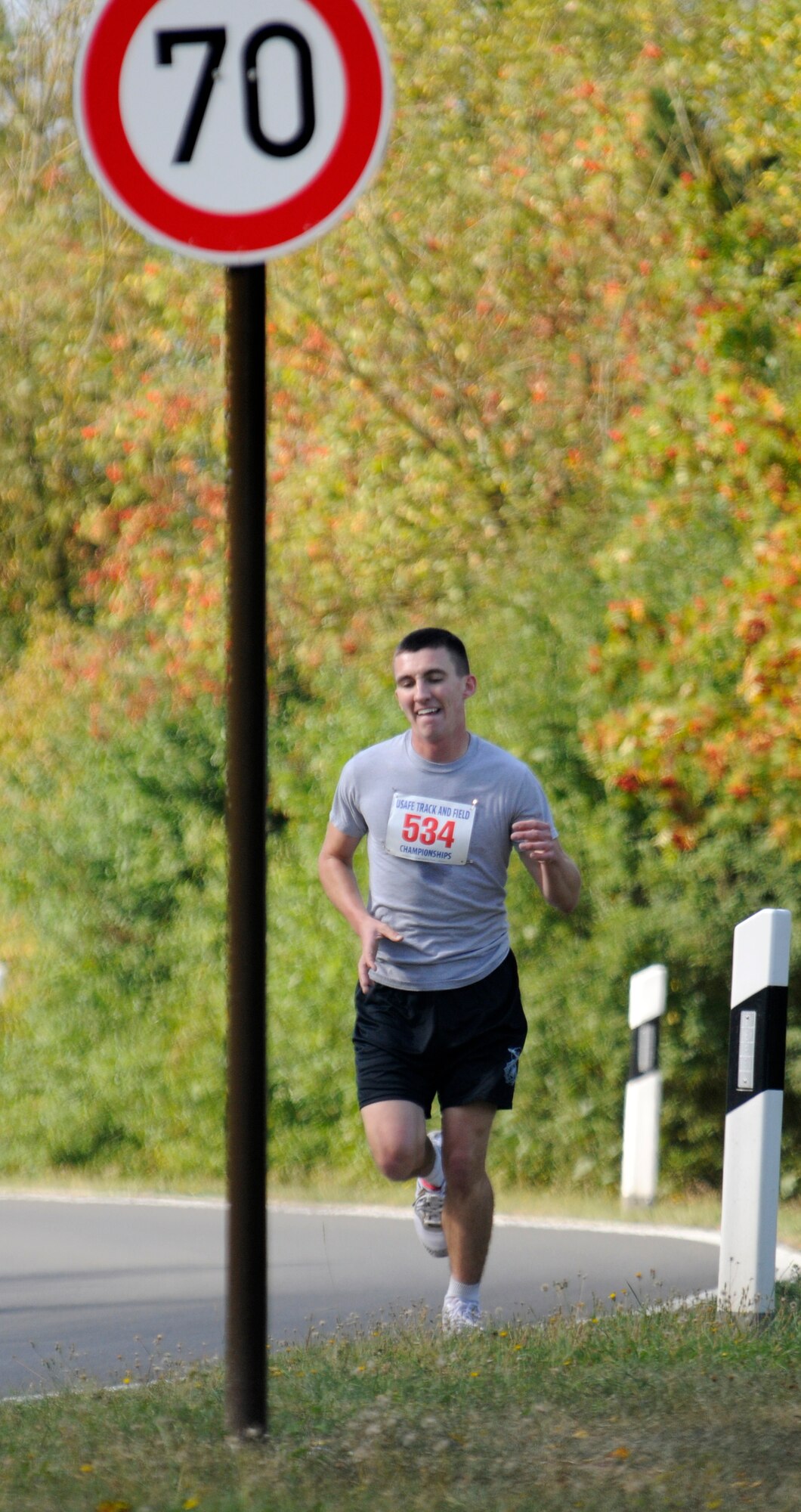 SPANGDAHLEM AIR BASE, Germany – Airman 1st Class Collin Meisel, 52nd Security Forces Squadron, holds a solid lead ahead of other 10 kilometer race competitors after more than two-thirds of the run was completed.  The fitness center staff organized simultaneous 10 and 5K runs Aug. 29 around the perimeter running paths on Spangdahlem. (U.S. Air Force photo/Master Sgt Bill Gomez)