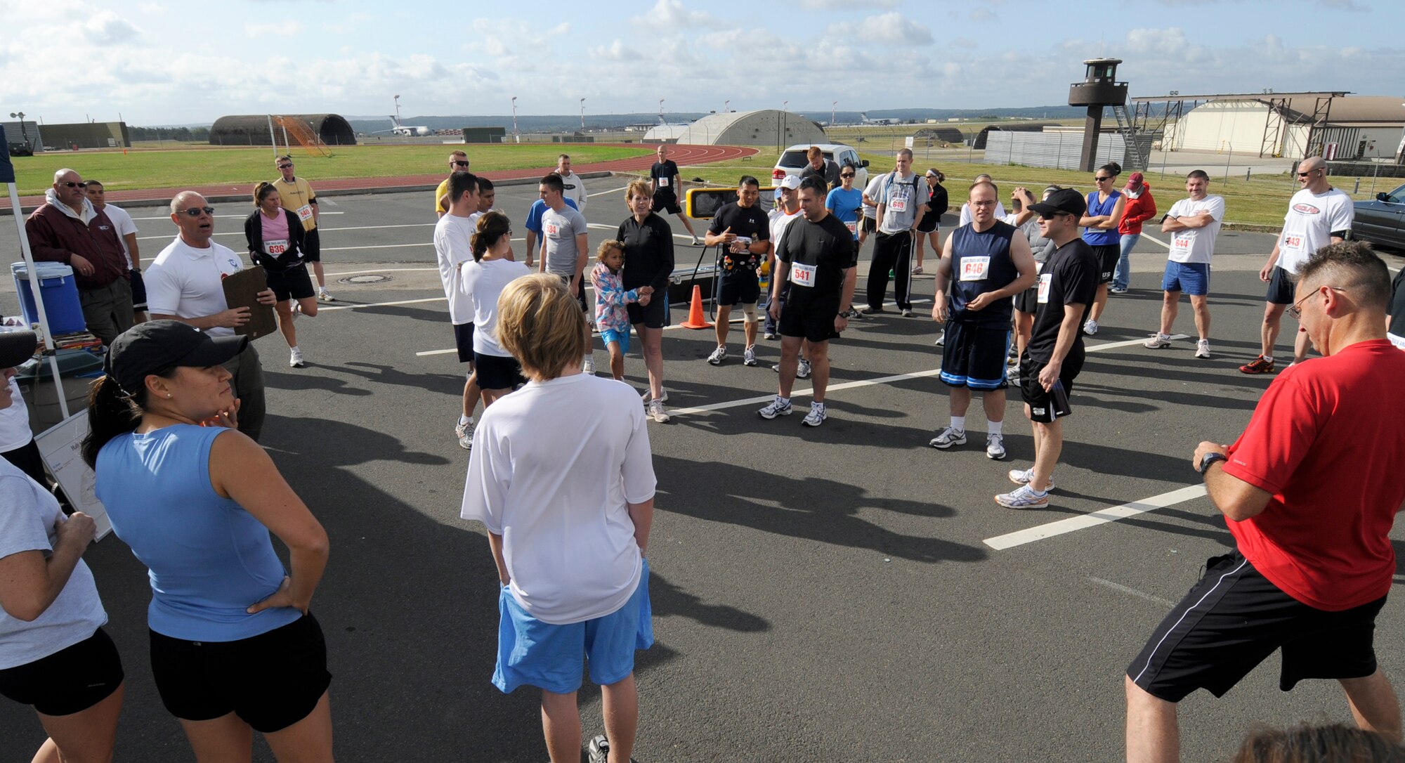 SPANGDAHLEM AIR BASE, Germany – Jergen Stockmeyer, fitness center manager and event planner, briefs runners on running routes and safety precautions prior to starting the 10 kilometer run Aug 29 at the track behind the fitness center.  The fitness center staff organized a simultaneous 10 and 5K runs around the perimeter running paths on Spangdahlem. (U.S. Air Force photo/Master Sgt Bill Gomez)