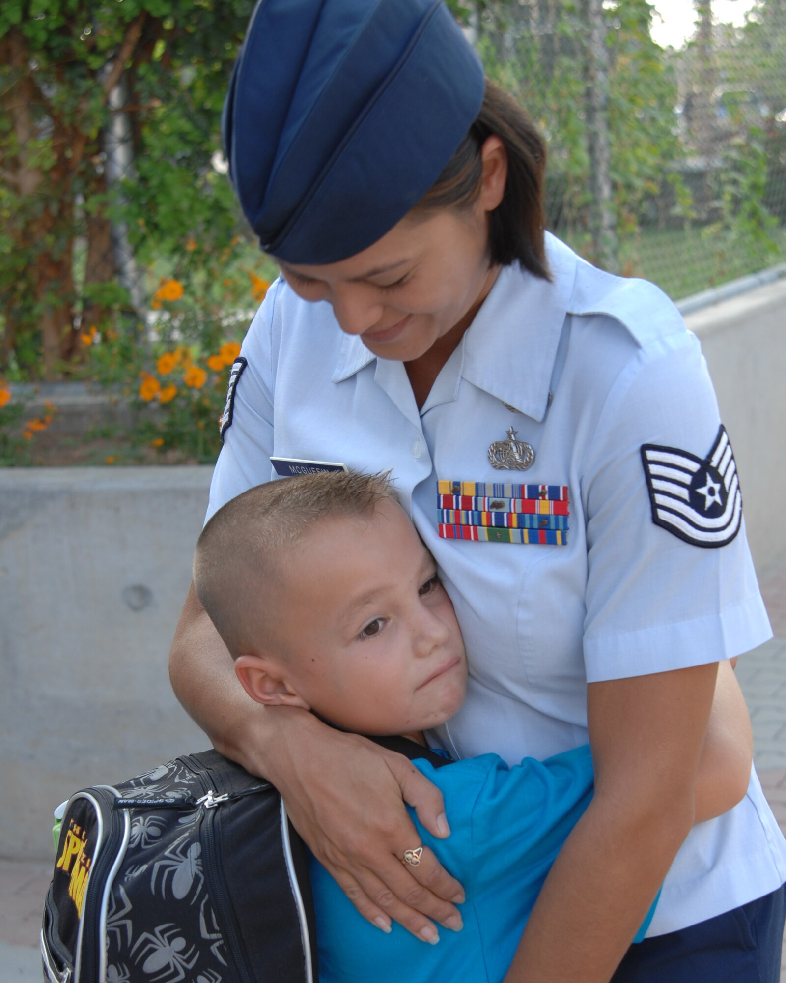 Tech. Sgt. Rose McGuffin, American Forces Network, Detachment 7, comforts her son, Devin, before his first day of second grade at Incirlik Unit School Monday, Aug. 31, 2009, Incirlik Air Base, Turkey. Col. Eric Beene, the 39th Air Base Wing commander, rang in the first day of school by sounding a gong along with Incirlik Unit School principal, Terry Greene. (U.S. Air Force photo/Staff Sgt. Lauren Padden)