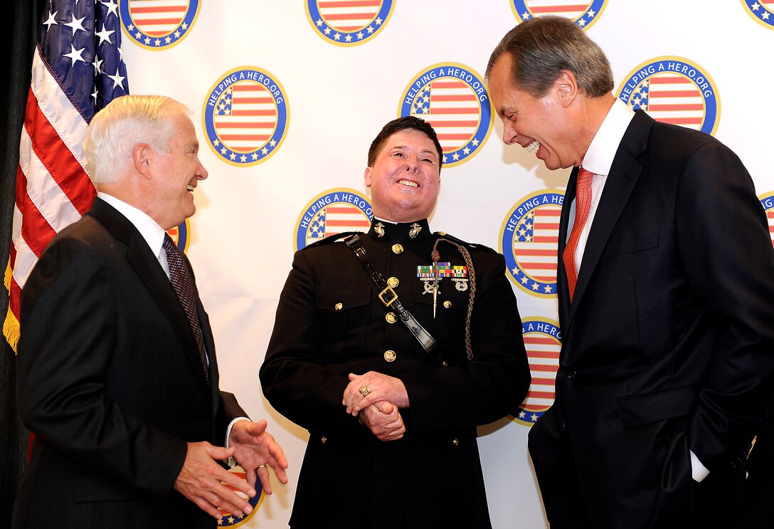 Defense Secretary Robert M. Gates, left, shares a laugh with retired U