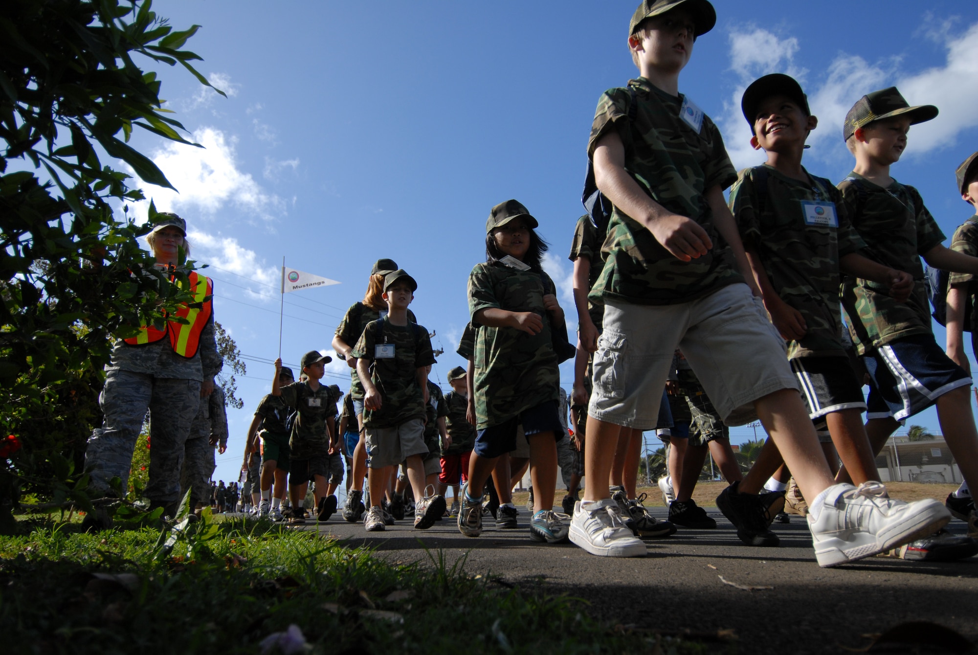 HICKAM AIR FORCE BASE, HAWAII -- Kids march during the sixth annual Operation Hele On, Aug. 21. Hele On is a program meant to give children of military members an idea of what goes on during a deployment. During the event, kids learned how to march, were issued mobility bags, and were bussed out to the Hickam flight line to tour a C-17 Globemaster III to simulate a deployment. (U.S. Air Force photo/Senior Airman Gustavo Gonzalez)