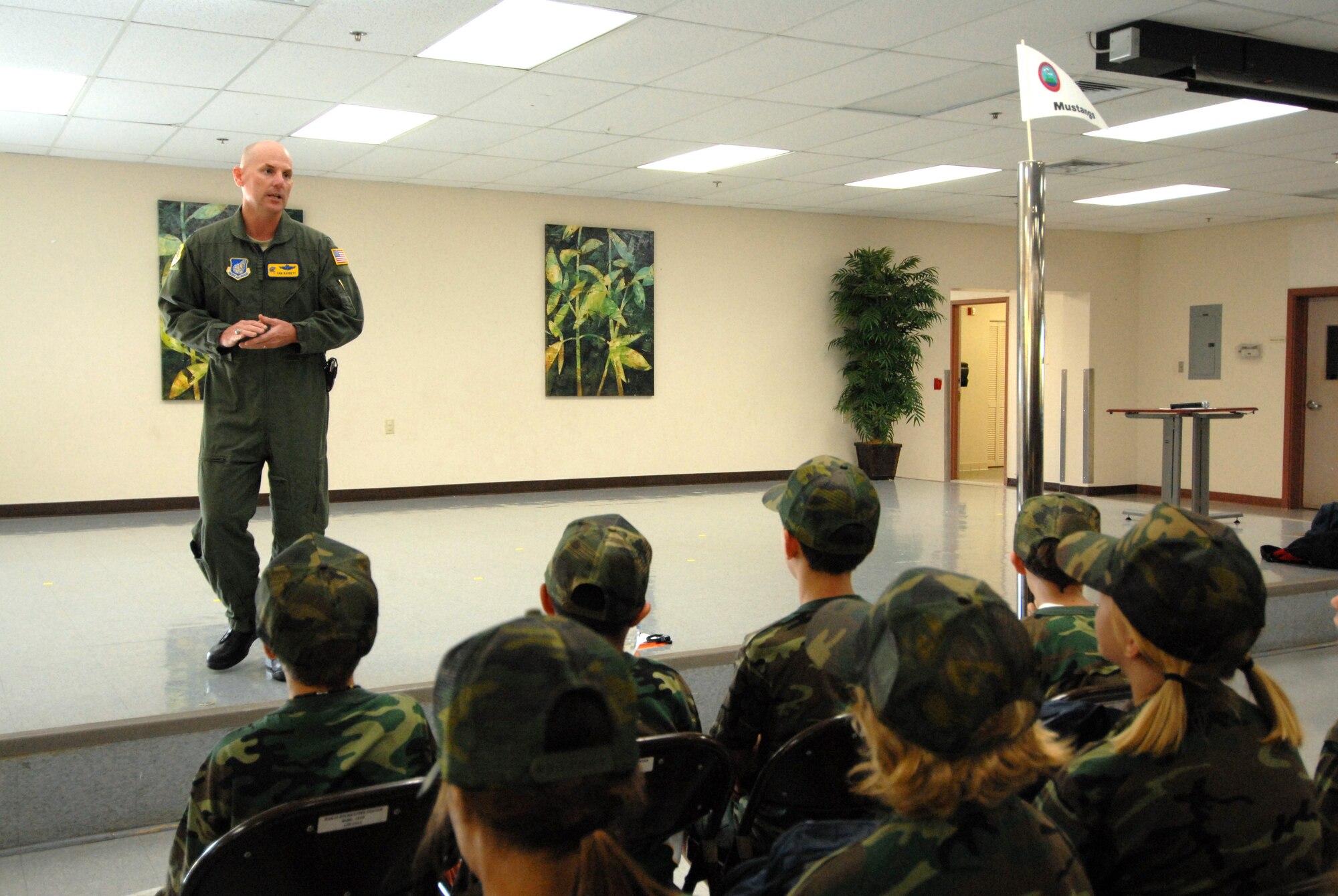 HICKAM AIR FORCE BASE, HAWAII -- Colonel Sam Barrett, 15th Airlift Wing vice commander, speaks to elementry school students during the sixth annual Operation Hele On, Aug. 21.  Hele On is a program meant to give children of military members an idea of what goes on during a deployment. During the event, kids learned how to march, were issued mobility bags, and were bussed out to the Hickam flight line to tour a C-17 Globemaster III to simulate a deployment. (U.S. Air Force photo/Senior Airman Gustavo Gonzalez)