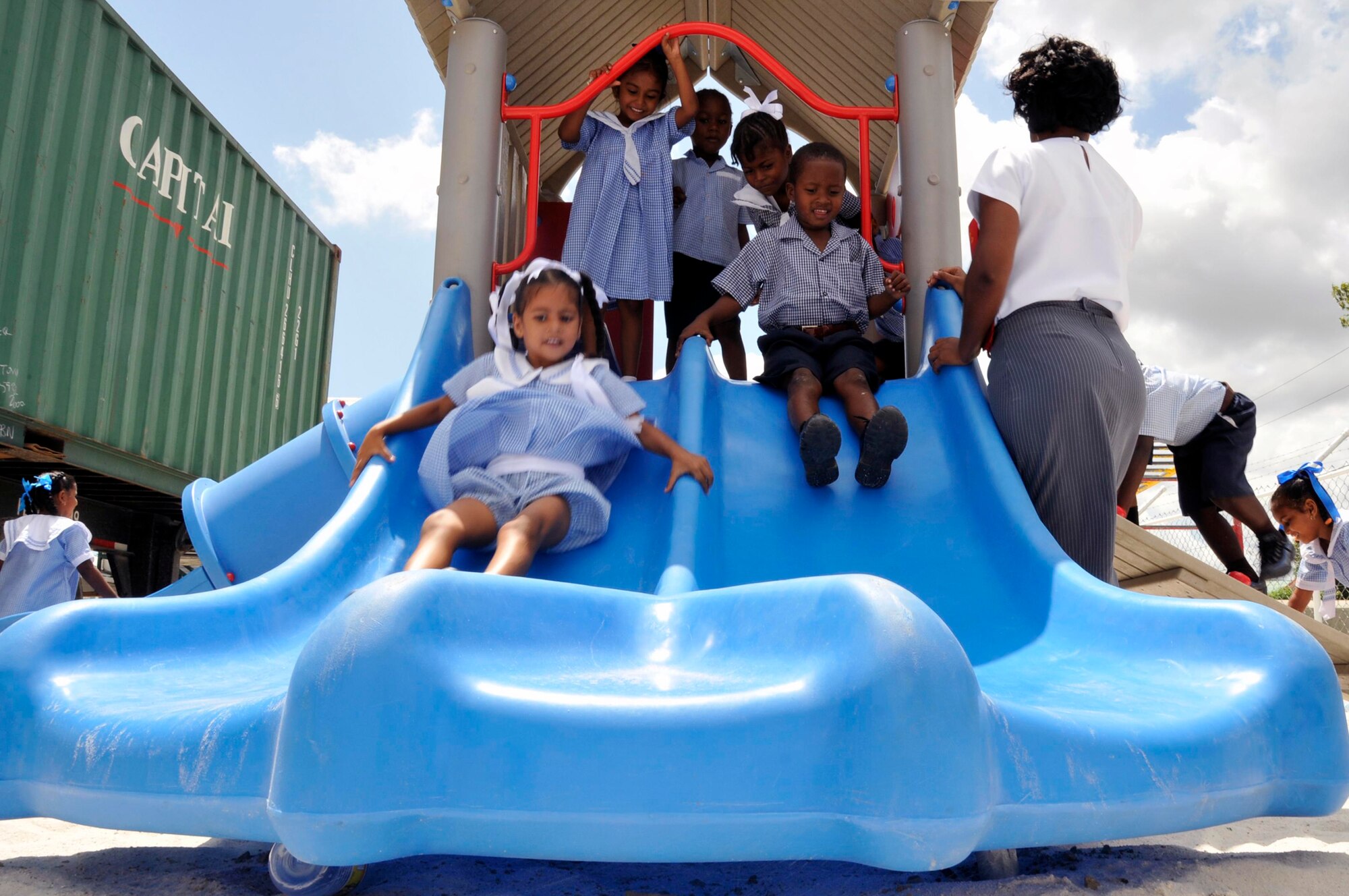 Guyanese children play on their brand new playground Sept. 1, 2009, at the Bel Air Primary, and Nursery Schools Georgetown, Guyana. U.S. Airmen built a playground for the primary school children, and one for the nursery school children, totaling over $ 37,000. (U.S. Air Force photo by Airman 1st Class Perry Aston) (Released)