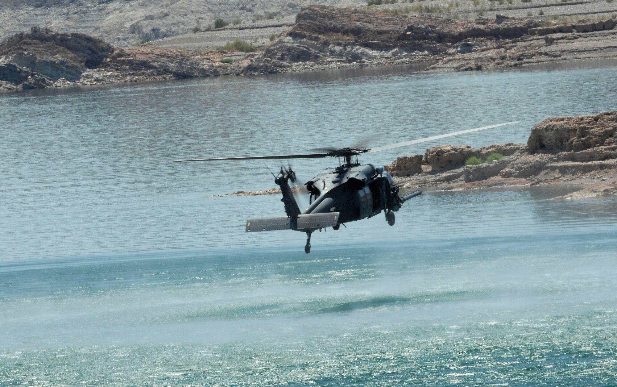 An Air Force HH-60 Pave Hawk, 66th Rescue Squadron from Nellis Air Force Base, Nev. holds in a hover position over Lake Mead during water rescue training Aug. 24, 2009.  
(U.S. Air Force photo/ Master Sgt. Kevin J. Gruenwald)  























  












 











































  












 

























