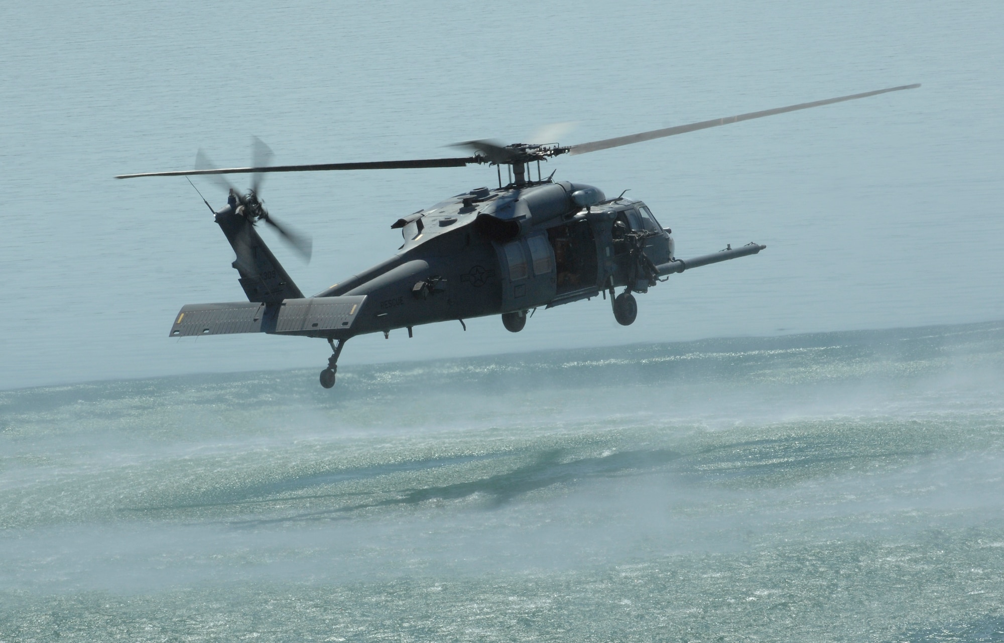 An Air Force HH-60 Pave Hawk, 66th Rescue Squadron from Nellis Air Force Base, Nev. holds in a hover position over Lake Mead during water rescue training Aug. 24, 2009.  
(U.S. Air Force photo/ Master Sgt. Kevin J. Gruenwald)





















  












 











































  












 

























