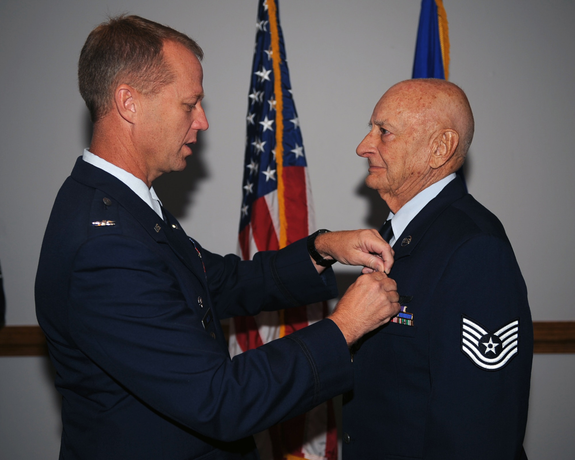 Col. Mark Kelly, 4th Fighter Wing commander, pins the World War II Victory Medal on WWII veteran Tech Sgt. Holt Thornton, on Seymour Johnson Air Force Base, N.C., Aug. 29, 2009. Mr. Thornton received five medals during a ceremony that recognized his service while assigned to the 763rd Bomb Squadron, 460th Bomb Group in Spinazzola, Italy. (U.S. Air Force photo by Senior Airman Ciara Wymbs)