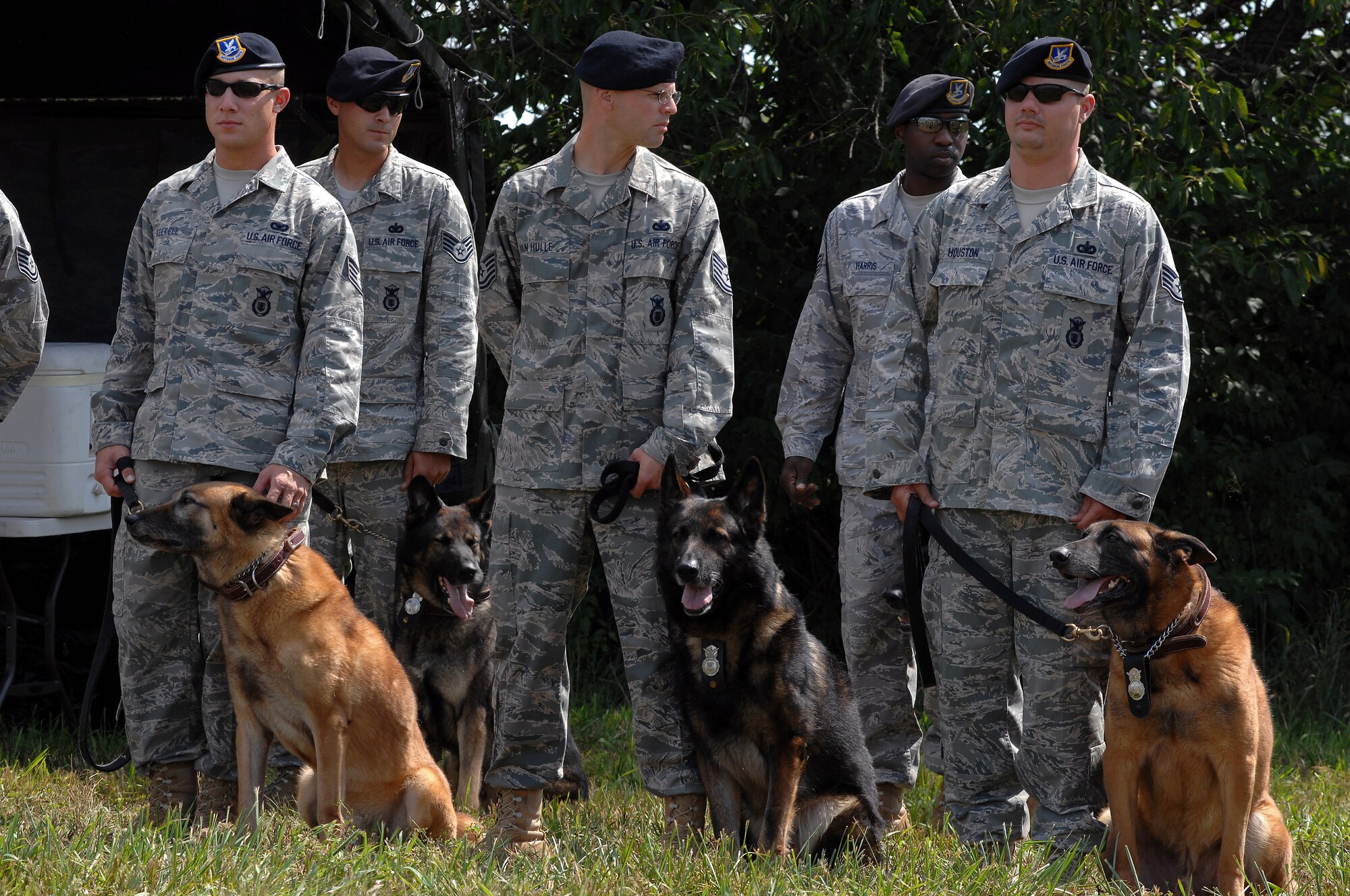WHITEMAN AIR FORCE BASE, Mo. - Members of the 509th Security Forces Squadron and their military working dogs, stand in place during a ground breaking ceremony for a new MWD facility Sept. 1. (U.S. Air Force photo/Senior Airman Kenny Holston) 