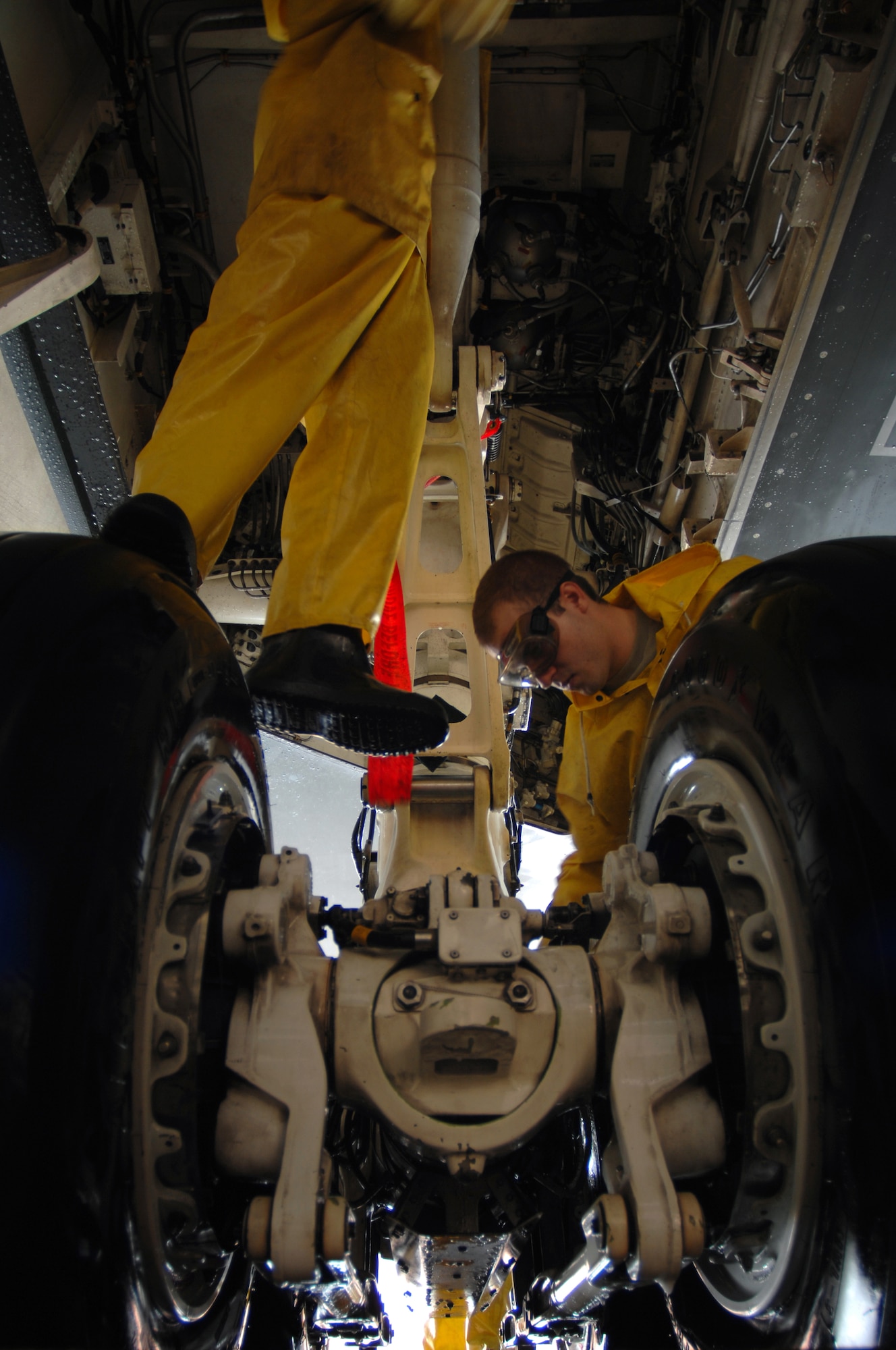 WHITEMAN AIR FORCE BASE, Mo. -- Airman 1st Class Patrick Holter, and Airman 1st Class Matthew Womack, both crew chiefs assigned to the 509th Aircraft Maintenance Squadron, work together to wash the inner wheel of a B-2 Spirit, Aug. 27. A full wash is conducted on a B-2 Spirit every 180 days and consists of three, six-to ten-men crews who work around the clock to get the job done within one to two days. (U.S. Air Force photo/Senior Airman Kenny Holston)