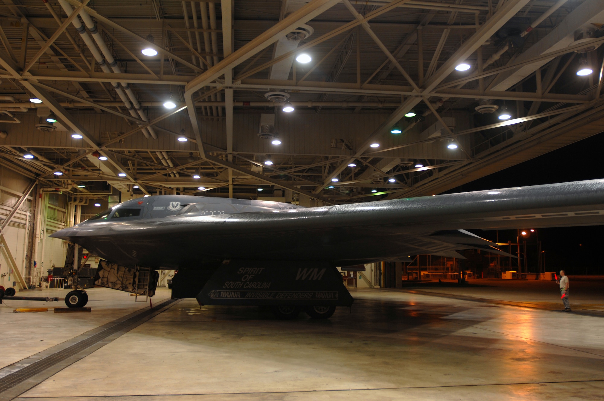 WHITEMAN AIR FORCE BASE, Mo. - Members of the 509th Aircraft Maintenance Squadron, tow a B-2 Spirit into a hanger to be washed, August 27. The B-2 Spirit is scheduled for a wash, every 180 days and takes one to two days to complete. (U.S. Air Force photo/Senior Airman Kenny Holston)