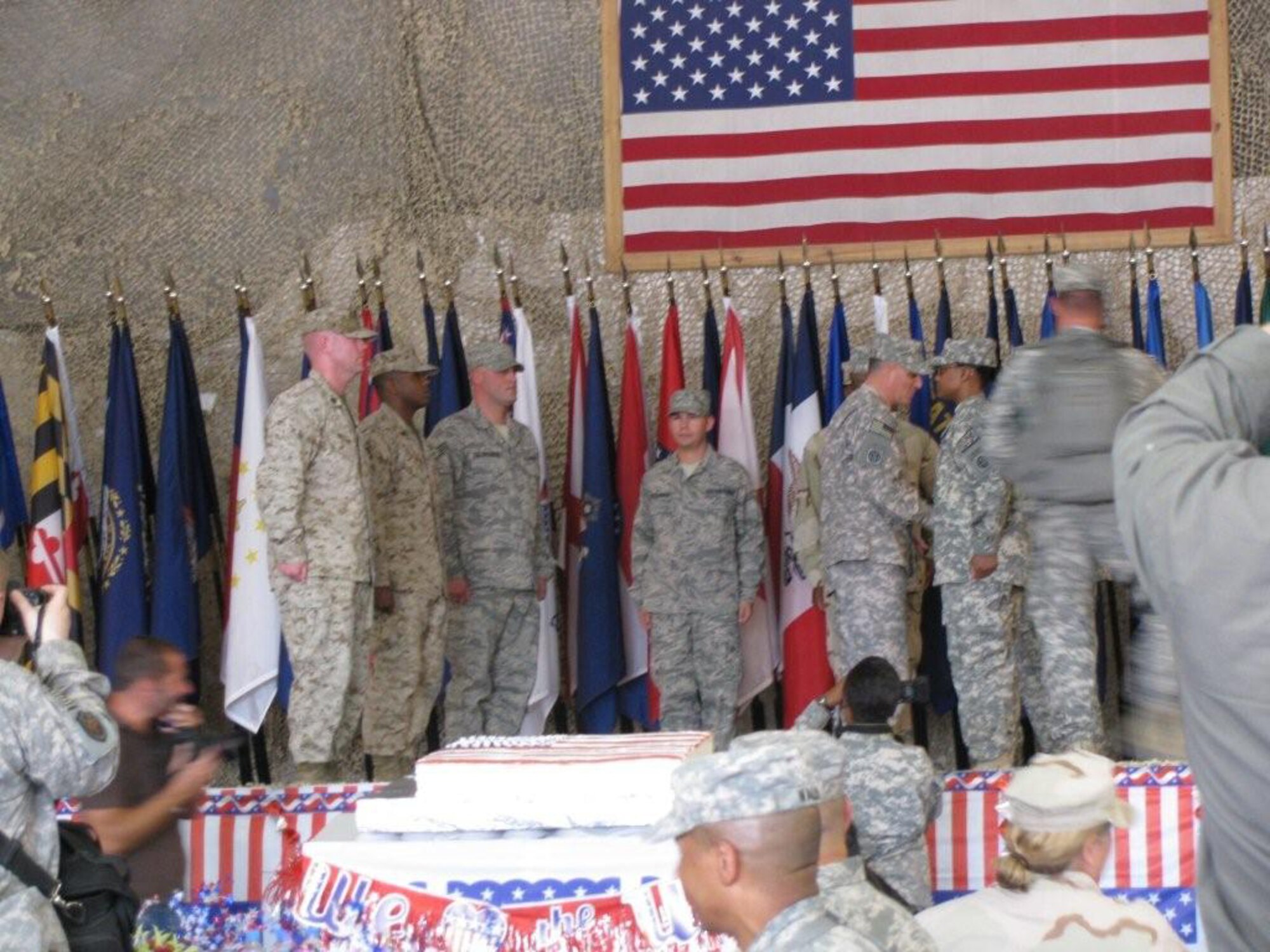 Two Westover Airmen took part in a Fourth of July joint re-enlistment ceremony held at Bagram Air Force Base.  Staff Sgt. Gregory Paczkowski and Senior Airman Anthony Tassinari both re-enlisted as part of the ceremony that was officiated by Major General Curtis M. Scaparrotti, United States Army, Commander of the 82nd Airborne. The ceremony took place in the Clamshell at Bagram AFB. The Combined Joint Task Force-82 Band performed the Army, Marine, Navy and Air Force songs in recognition of each branch.  Each re-enlistee was presented the Major General?s coin.