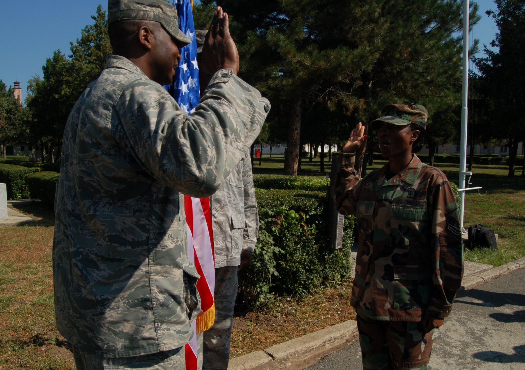 NIS, Serbia – Master Sgt. Yoketha Sims, 86th Medical Group medical logistician at Ramstein Air Base, Germany, recites the Oath of Enlistment following the lead of Lt. Col. Alfred Flowers, 86th Medical Support Squadron commander also at Ramstein AB following the opening ceremony of the military medical training exercise in Central and Eastern Europe, or MEDCEUR 2009, in Nis, Serbia. “I’m proud to see how she has progressed and has become an outstanding senior NCO,” said Colonel Flowers or Sergeant Sims’ 15 years in the Air Force. (U.S. Air Force photo/Senior Airman Kali L. Gradishar)