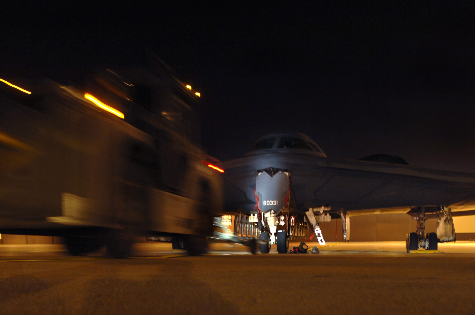 WHITEMAN AIR FORCE BASE, Mo. - Members of the 509th Aircraft Maintenance Squadron, tow a B-2 Spirit to a hanger to be washed, August 27. (U.S. Air Force photo/Senior Airman Kenny Holston)