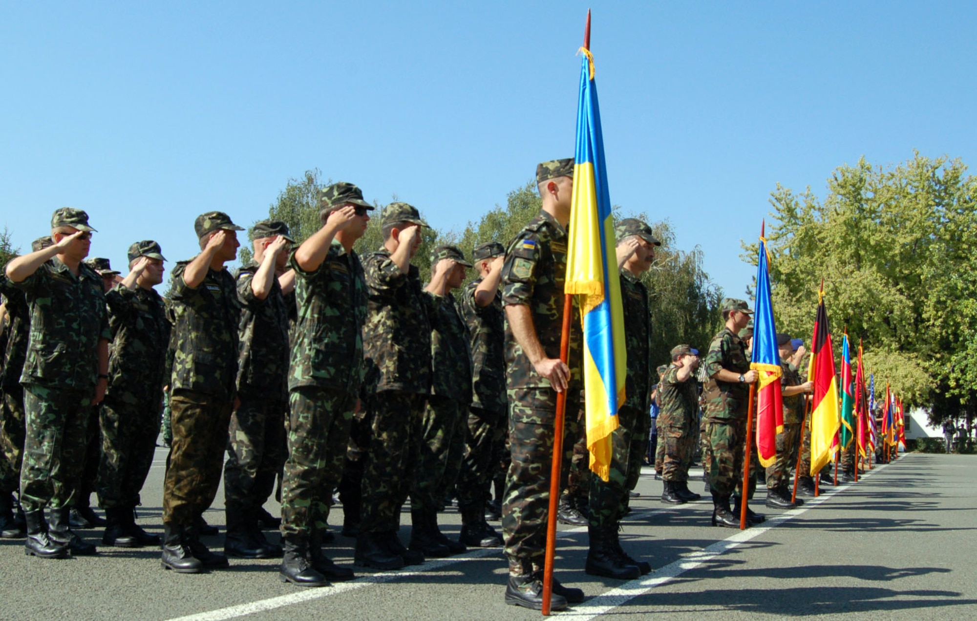 NIS, Serbia – Military members from 15 nations salute as the Serbian and American national anthems are played at the military medical training exercise in Central and Eastern Europe, or MEDCEUR 2009, opening ceremony Sept. 2 at the Knjaz Mihailo Barracks here. Serbia is the host nation for the exercise, while the U.S. is a major supporter of set-up, events and tear-down of the exercise which will run Sept. 2-13. (U.S. Air Force photo/Senior Airman Kali L. Gradishar)