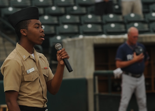 Hospital Corpsman Christian Ross sings the national anthem at the Charleston RiverDogs baseball game Aug. 26 at Joseph P. Riley Jr. Park during the second military appreciation night held by the team in 2009. The RiverDogs are a Class-A affiliate of the New York Yankees and have celebrated more than ten year of baseball action in "The Joe." Corpsman Ross is with the Charleston Naval Health Clinic. (U.S. Air Force photo/Senior Airman Katie Gieratz)