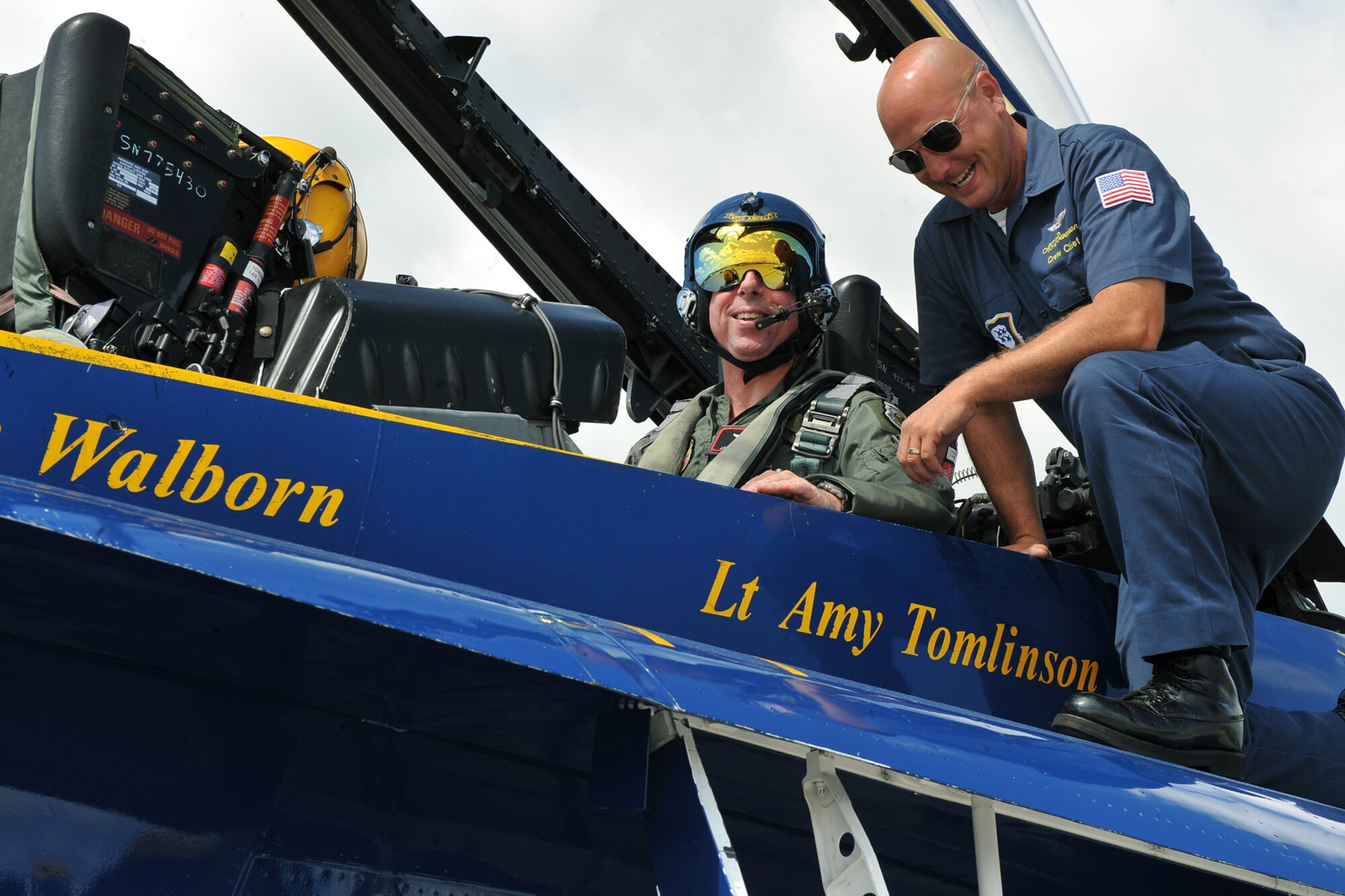 OFFUTT AIR FORCE BASE, Neb., -- Brig. Gen. John N.T. Shanahan, 55th Wing commander and Petty Officer 2nd Class Chad Swanson, a crew chief for the U.S. Navy's Blue Angels, enjoy some laughs as General Shanahan prepares for a flight in one of the Blue Angels F-18 hornets here Aug. 28. U.S. Air Force Photo by Charles Haymond    