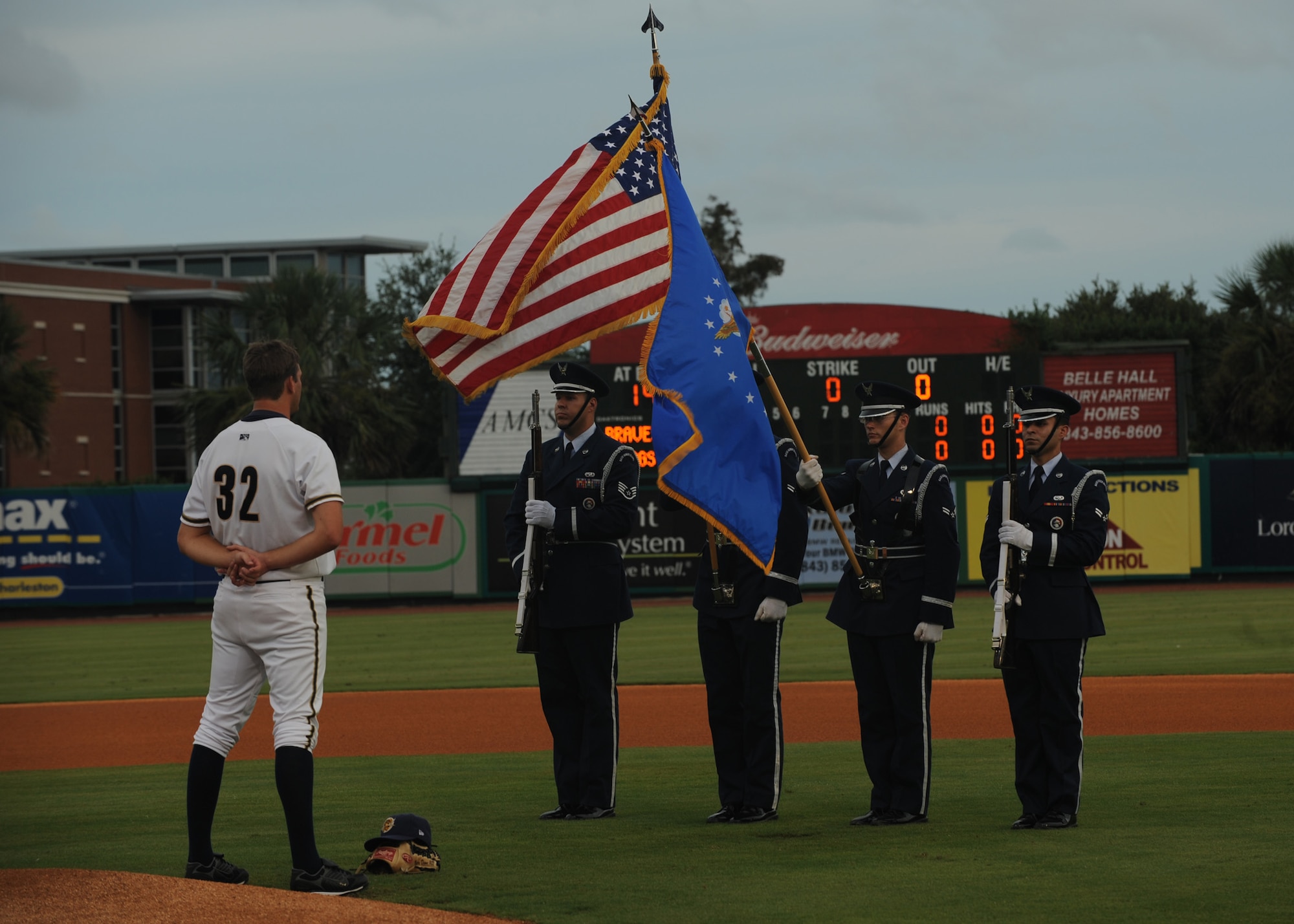 Members of the Charleston AFB honor guard post the colors on the field at Joseph P. Riley Jr. Park before the start of a Charleston RiverDogs baseball game Aug. 26. The base honor guard regularly performs details in the Charleston area demonstrating Air Force patriotism, professionalism and military bearing throughout the community. (U.S. Air Force photo/Senior Airman Katie Gieratz)