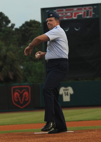 Col. Don Shaffer winds up to throw out the first pitch at the start of a Charleston RiverDogs game at Joseph P. Riley Jr. Park  Aug. 26. The RiverDogs traditionally hold two military appreciation nights during the year, with the first one being in May in support of Military Appreciation Month and the second in August. Colonel Shaffer is the 437th Airlift Wing vice commander. (U.S. Air Force photo/Senior Airman Katie Gieratz)