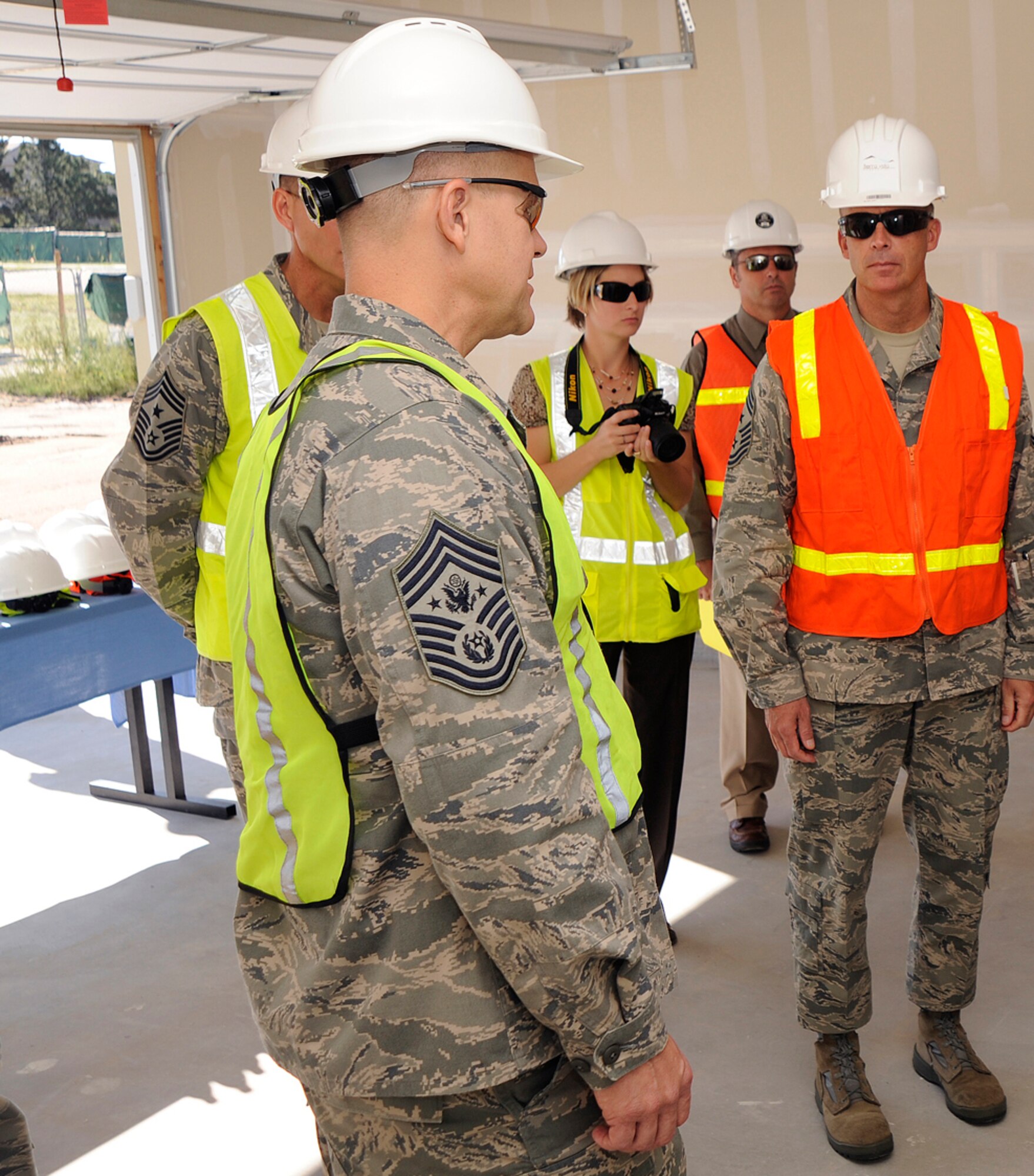 Chief Master Sgt. Tim Omdal, 21st Space Wing command chief (right), explains the Peterson privatized housing initiative to Chief Master Sgt. of the Air Force James Roy (left), Aug. 27. The privatized housing initiative is the largest quality of life project on Peterson Air Force Base for the next five years. During his visit here, Chief Roy discussed key focus areas such as training, base development and the Year of the Air Force Family in his first Peterson visit since his appointment as the Air Force’s senior-ranking enlisted member in June. (Air Force photo by Craig Denton)