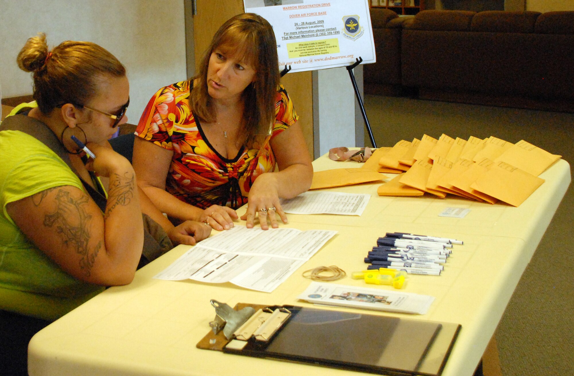 (Right) Dawn Casey, 436th Medical Group Nursing case manager, assists Cristina McBride in the process of registering for the C.W. Bill Young Department of Defense Marrow Donor Program Aug. 27 at the base medical clinic. The marrow donor program is a subsidiary of the National Marrow Donor Program and connects possible donors to people needing a transplant. (U.S. Air Force photo/Airman 1st Class Matthew Hubby)