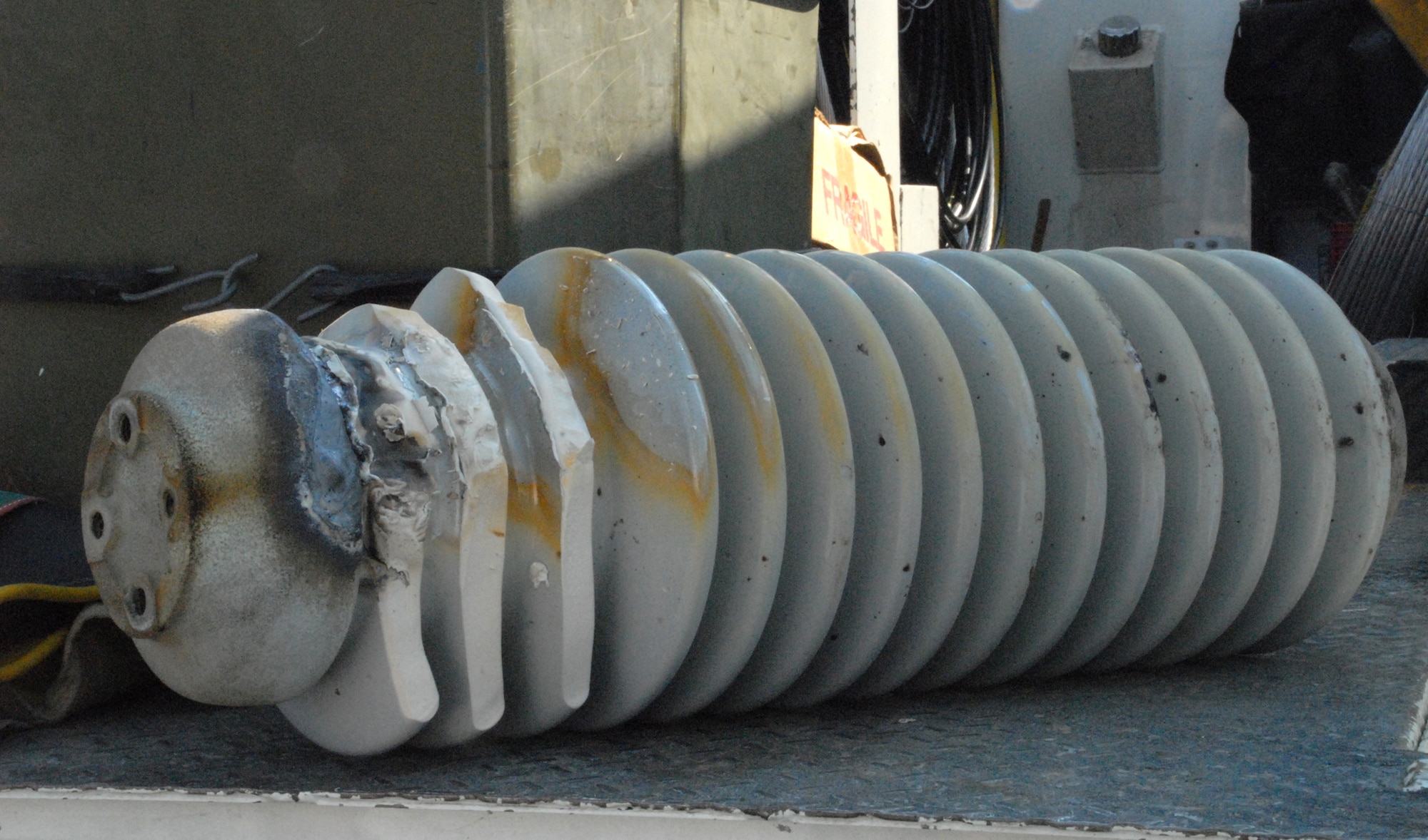 An insulator was damaged when a part failed at an electrical substation Aug. 27 causing Dover Air Force Base to lose power for more than two hours. The insulator is designed to protect the more sensitive parts of the electrical substation. (U.S. Air Force photo/Airman 1st Class Matthew Hubby)