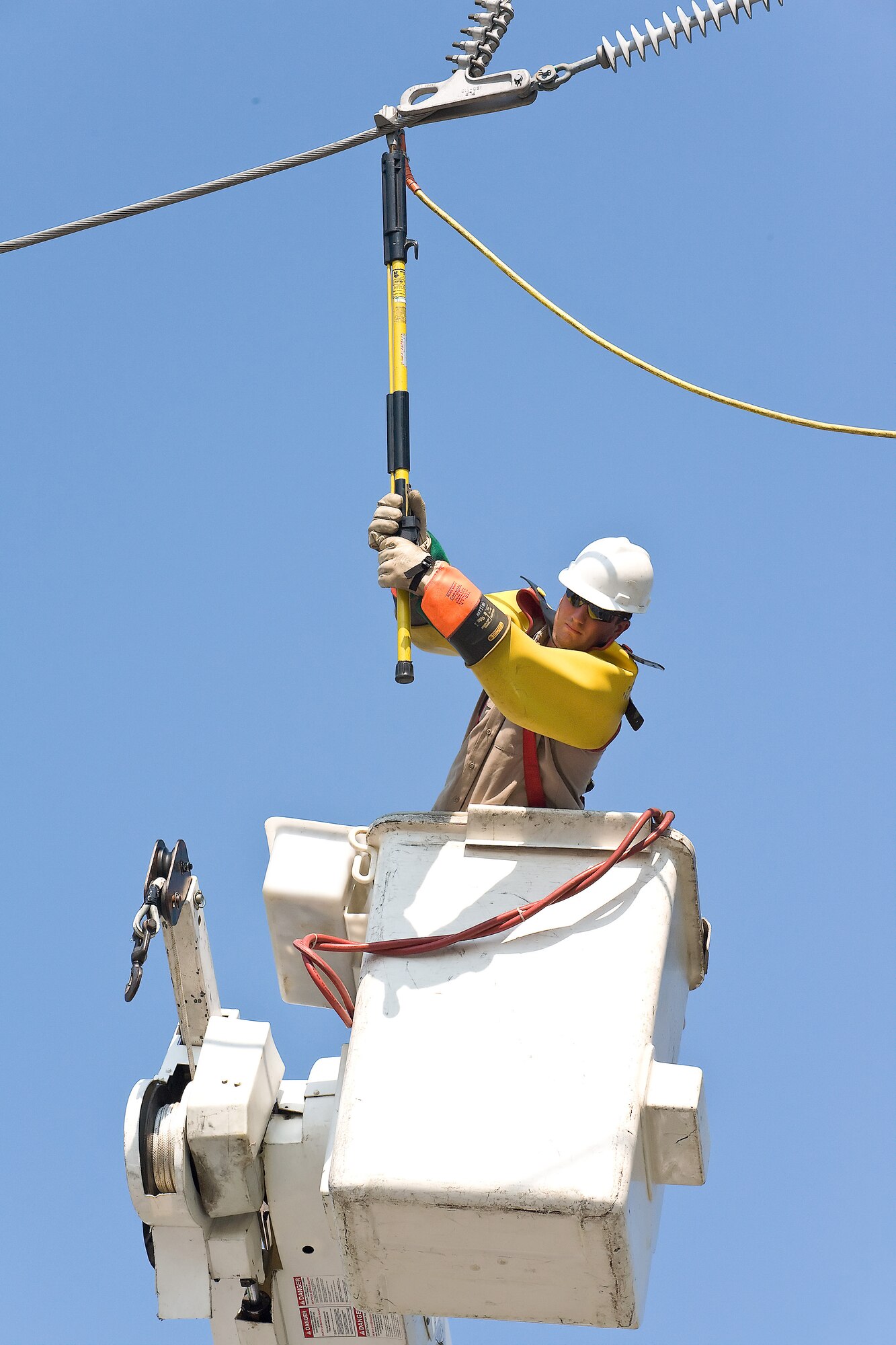 A City of Dover electric technician replaces a part that failed Aug. 27 causing Dover Air Force Base to be without power for more than two hours. (U.S. Air Force photo/Roland Balik)