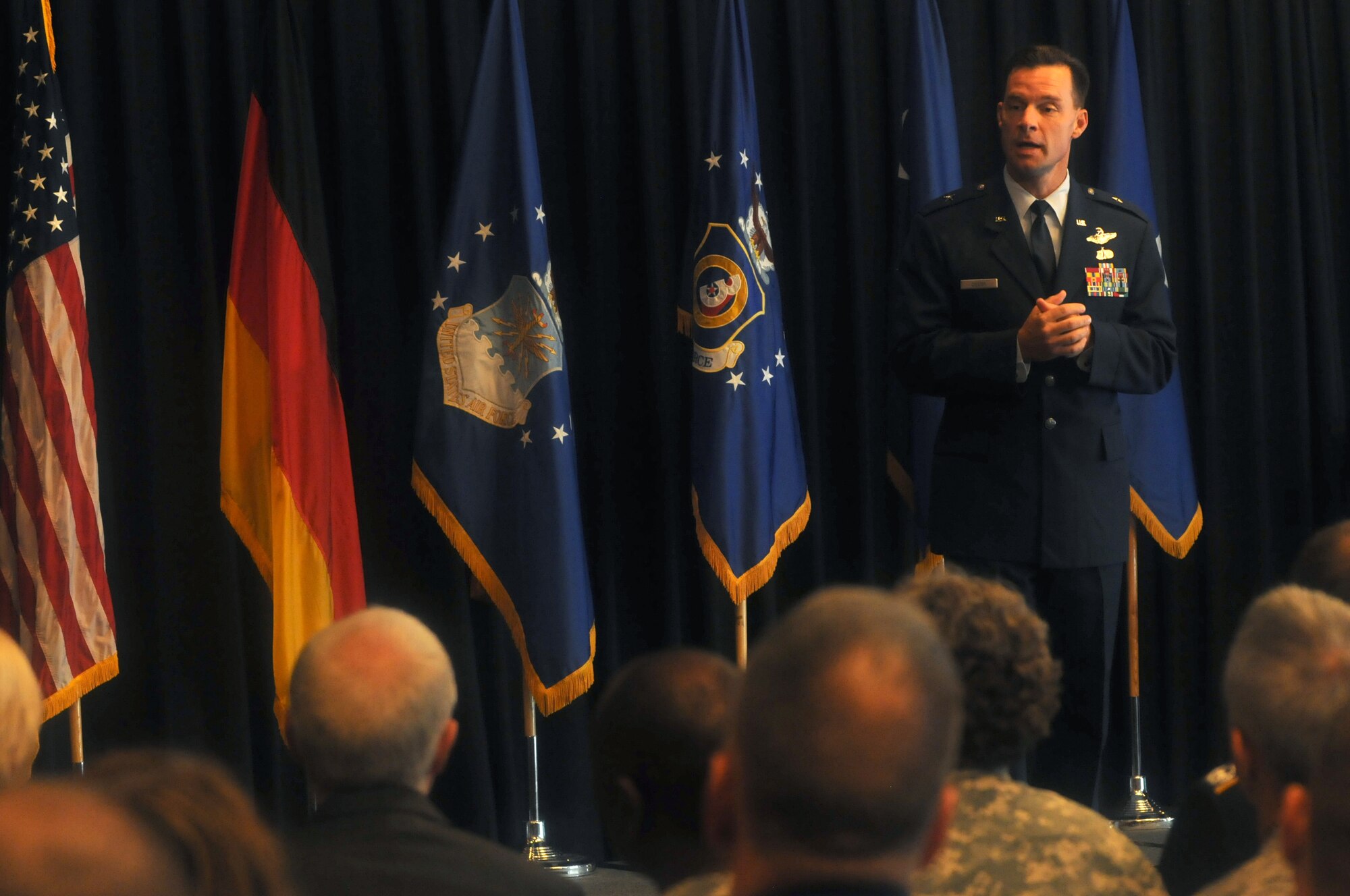 Brig. Gen. Mark Dillon, 86th Airlift Wing commander, speaks at his promotion ceremony at the Officer's Club on Ramstein Air Base, Germany, Sept. 2. Lt. Gen. Frank Gorenc, 3rd Air Force commander, presided over the ceremony. (U.S. Air Force photo by Staff Sgt. Charity Barrett)