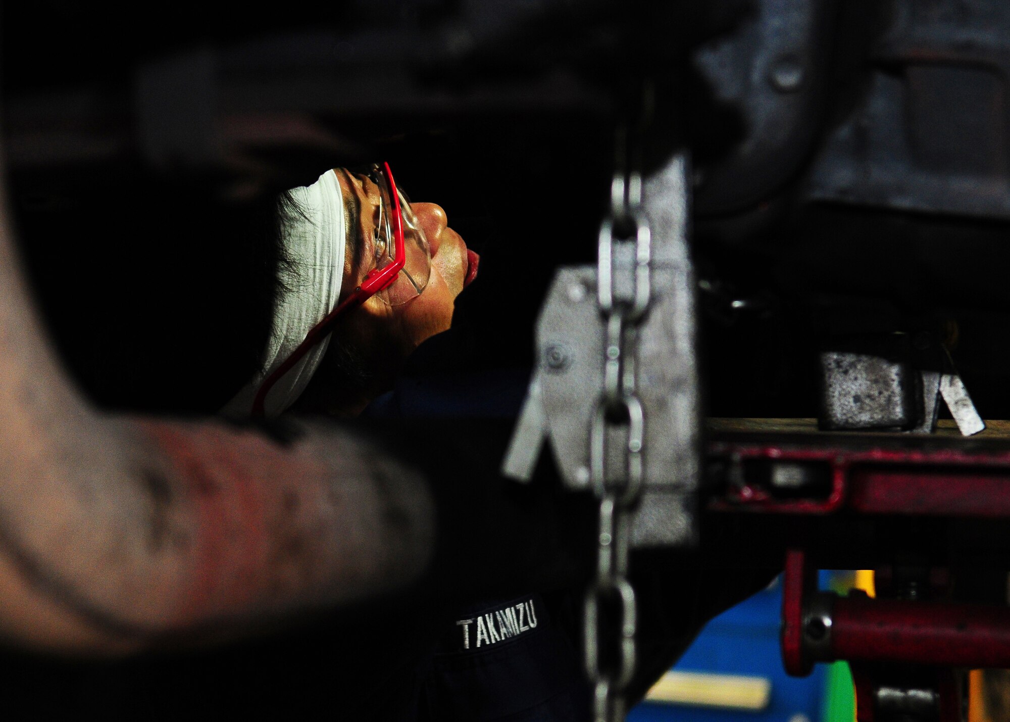 YOKOTA AIR BASE, Japan -- Masao Takamizu, 374th Logistics Readiness Squadron vehicle maintenance technician, replaces the clutch on an Isuzu Giga recently. The vehicle maintenance flight inspects, repairs, maintains and refurbishes government-owned vehicles here. (U.S. Air Force photo/Airman 1st Class Michael Dillon)