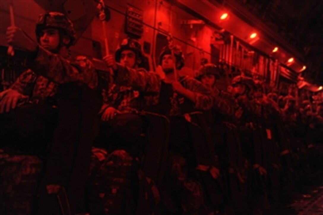 U.S. Army soldiers from the 82nd Airborne Division hold their static lines just before jumping from a U.S. Air Force C-17 Globemaster III aircraft during a joint forcible entry exercise over Ft. Bragg, N.C., on Aug. 26, 2009.  