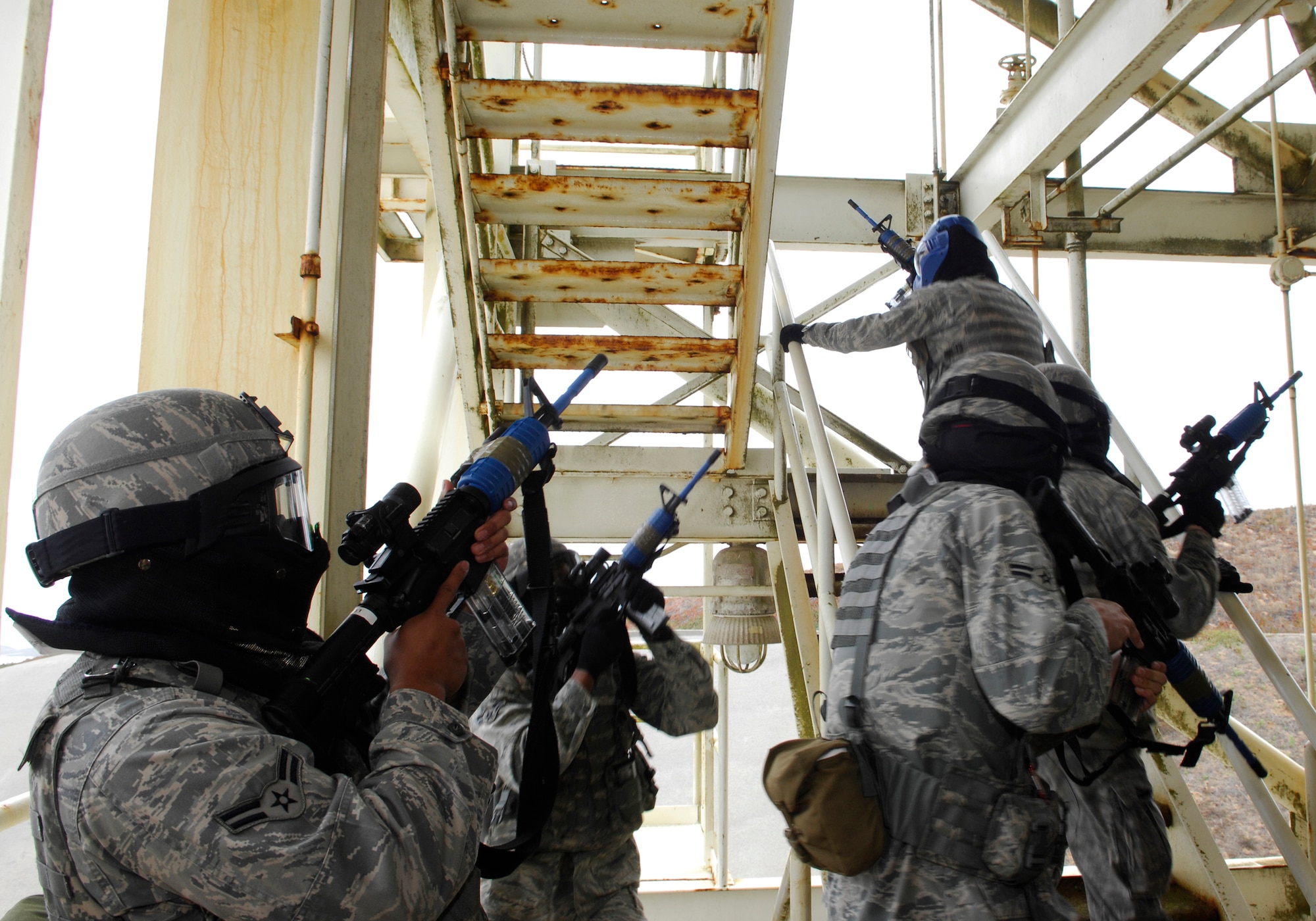 VANDENBERG AIR FORCE BASE, Calif. -- In an effort to learn tactical movements, Airmen of the 30th Security Forces Squadron ascend 13 flights of stairs while attempting to remain undetected here Aug. 11. The exercise is part of close-quarter combat training -- just one of the many sessions attended during monthly flight training. (U.S. Air Force photo/Airman 1st Class Heather R. Shaw)