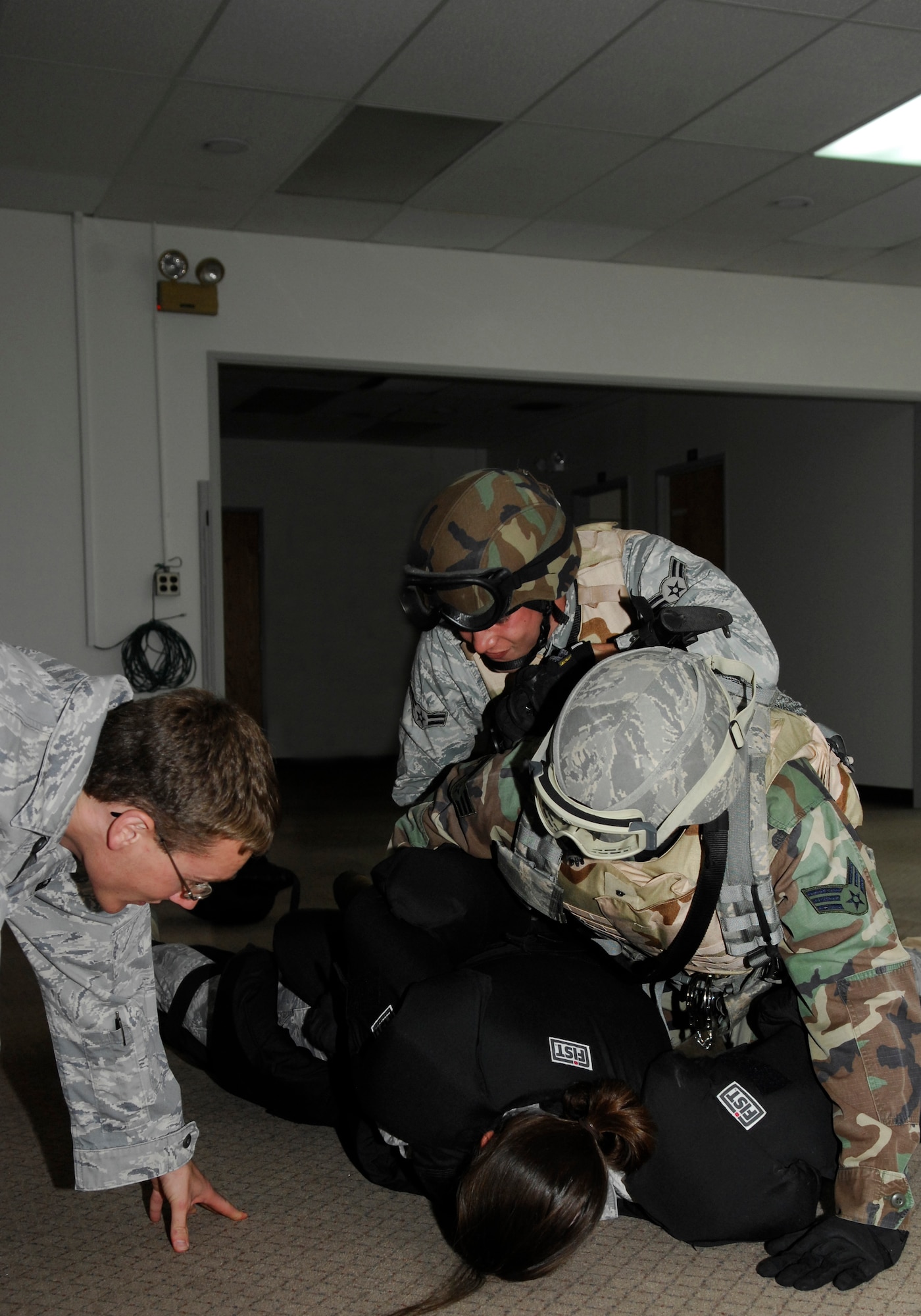 VANDENBERG AIR FORCE BASE, Calif. -- In an effort to learn the proper use of force guidelines and take-down techniques Airmen from the 30th Security Forces Squadron participate in Red Man training here Aug. 18. The training incorporates the use of a large, padded bodysuit to ensure safety during take-downs as well as the added difficulty which prepares the Airmen for tougher suspect apprehensions.  (U.S. Air Force photo/Airman 1st Class Heather R. Shaw)