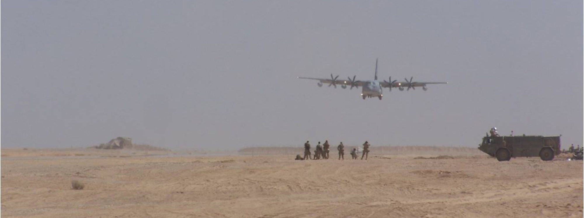 A C-130 lands on an assault landing strip built by the 809th Expeditionary RED HORSE Squadron, Marine Corps, Navy Seabees and local contractors at Dwyer Forward Operating Base, Afghanistan. (Courtesy photo)