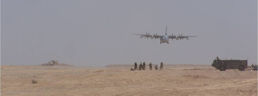 A C-130 lands on an assault landing strip built by the 809th Expeditionary RED HORSE Squadron, Marine Corps, Navy Seabees and local contractors at Dwyer Forward Operating Base, Afghanistan. (Courtesy photo)