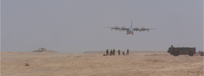 A C-130 lands on an assault landing strip built by the 809th Expeditionary RED HORSE Squadron, Marine Corps, Navy Seabees and local contractors at Dwyer Forward Operating Base, Afghanistan. (Courtesy photo)