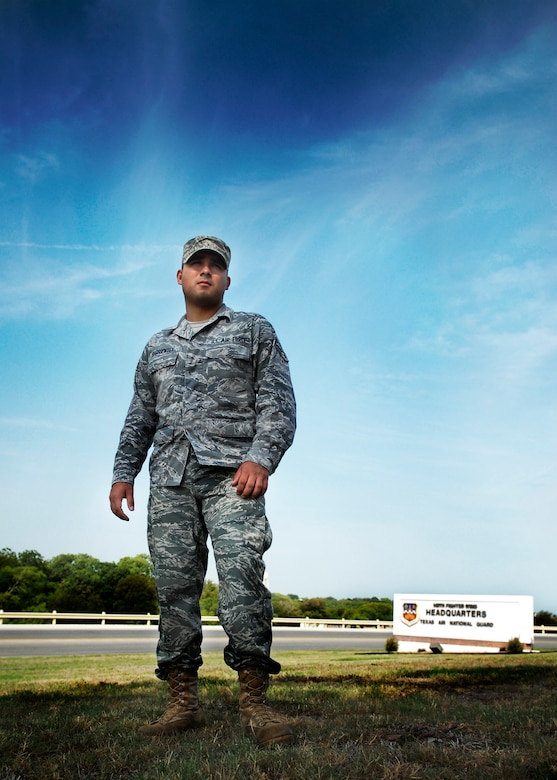 Airman 1st Class Kris Barrientes, a financial service technician with the Texas Air National Guard's 149th Fighter Wing, stands in front of the wing's command post at Lackland Air Force Base, Texas, on September 3, 2009. (U.S. Air Force photo/Staff Sgt Eric L. Wilson)