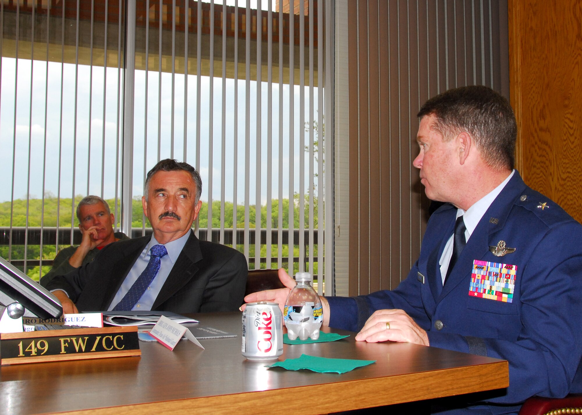 Brig. Gen. John Nichols, commander of the Texas Air National Guard, discusses the 149th Fighter Wing with U.S. Rep. Ciro Rodriguez, of San Antonio, at Lackland Air Force Base, Texas, on August 28, 2009. (U.S. Air Force photo/Staff Sgt Phil Fountain)