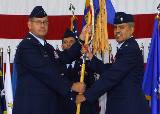 MINOT AIR FORCE BASE, N.D.-- Col. Charles E. Patnaude, 5th Operations Group commander, passes the guidon to Lt. Col Michael Cardoza, 69th Bomb Squadron commander, during the 69th’s activation ceremony here, Sept. 3. The new squadron was established to provide each B-52 Wing with two active-duty combat coded squadrons, which will give the Air Force “bench depth” to rotate the squadrons across the mission sets as recommended in the Defense Science Board Report. (U.S. Air Force photo by Tech. Sgt. Lee A. Osberry Jr.)