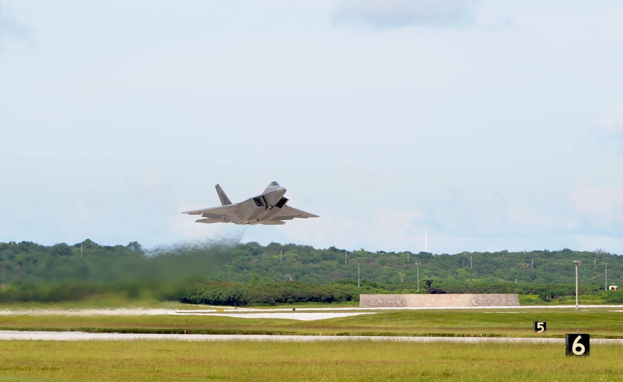 An F-22 Raptor from the 525th Expeditionary Fighter Squadron takes off from
Andersen Air Force Base, Guam, Aug. 25.  The Raptors were flying to support
an exercise known as Jungle Shield.  The F-22s are deployed from Elmendorf
AFB, Alaska, to support U.S. Pacific Command's Theater Support Package in
the Asia-Pacific region.  (U.S. Air Force photo/Senior Airman Christopher
Bush/Released)
