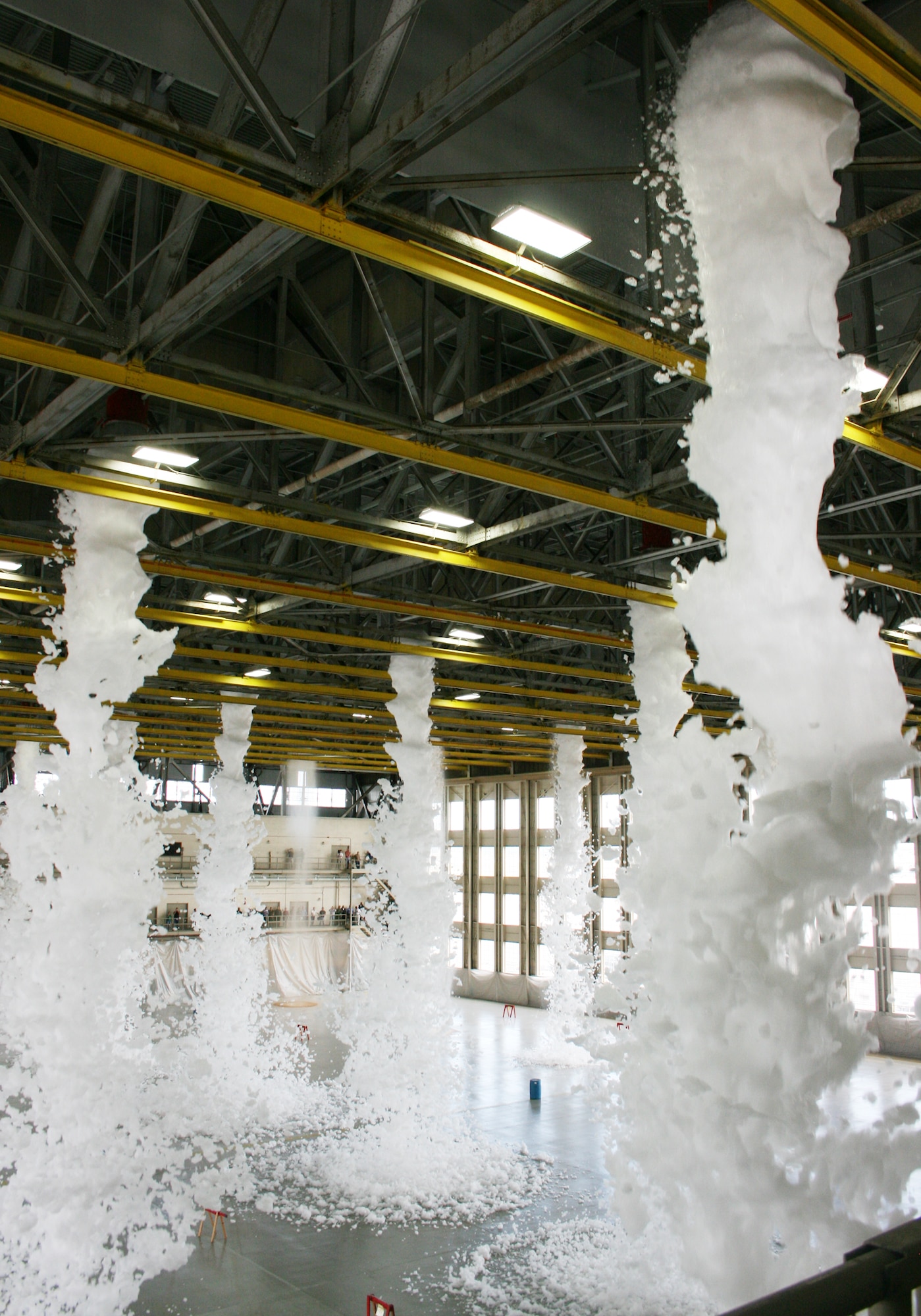 Approximately 110 gallons of biodegradable foam poured from the ceiling of King Hangar Sept. 3 at Eglin Air Force Base during the final test of the new fire suppression system.  It took only two minutes for the 24 foam generators to fill the 90,000 square foot hangar with more than three feet of foam.  This was part of an ongoing process to update the historic Eglin icon.  (U.S. Air Force photo/2nd Lt. Andrew Caulk.)