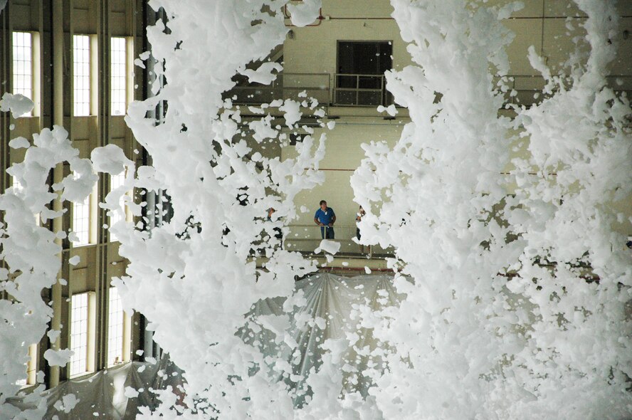 Approximately 110 gallons of biodegradable foam poured from the ceiling of King Hangar Sept. 3 at Eglin Air Force Base during the final test of the new fire suppression system.  It took only two minutes for the 24 foam generators to fill the 90,000 square foot hangar with more than three feet of foam.  This was part of an ongoing process to update the historic Eglin icon.  (U.S. Air Force photo/Airman 1st Class Chris Jacobs.)