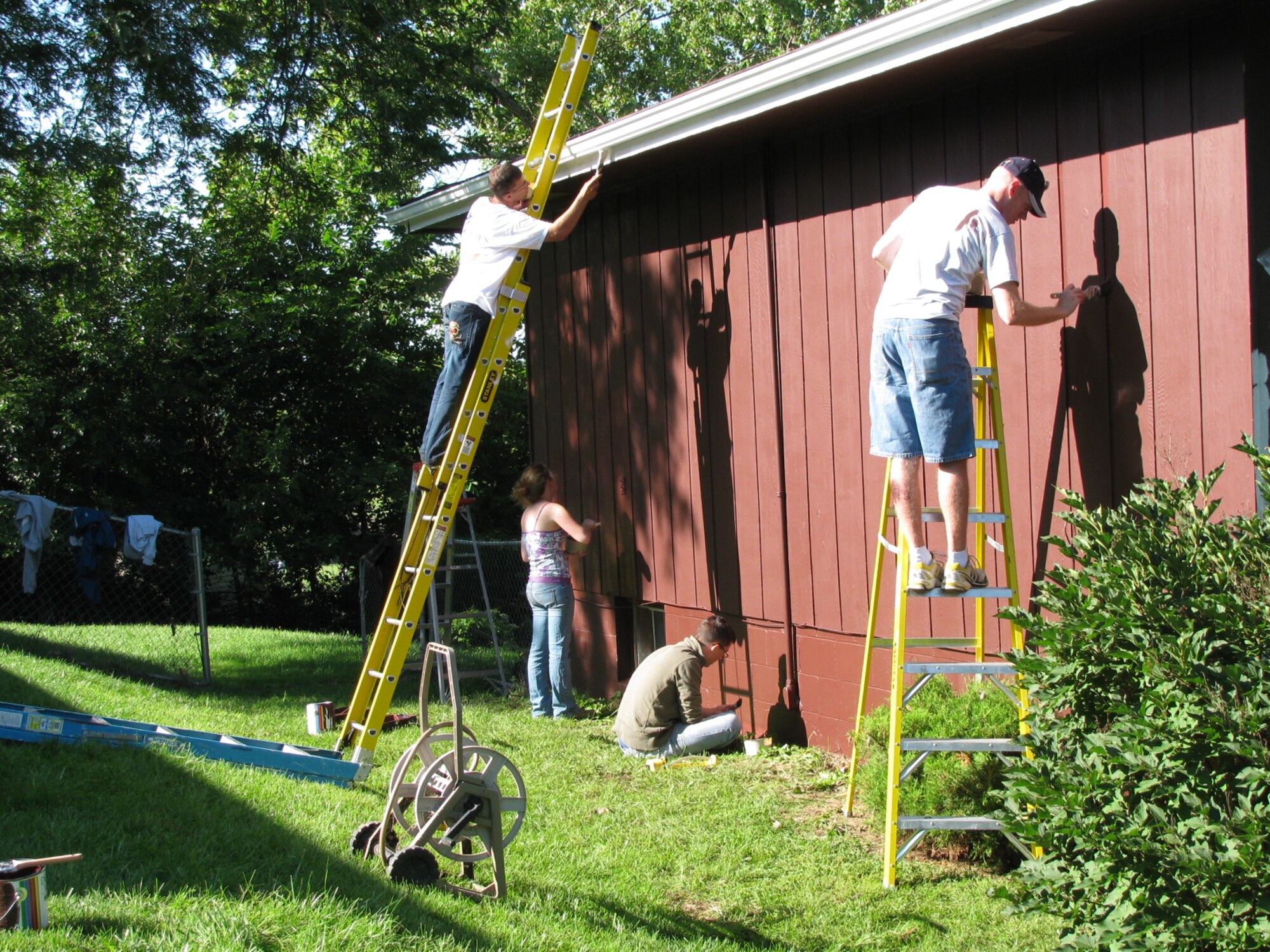 BELLEVUE, Neb. -- Members of Team Offutt paint a house in Bellevue, Neb. Aug. 22 during the 21st annual Brush Up Nebraska Paint-A-Thon. The annual event started in Sept. 1989, since then more than 2,000 homes have been painted. U.S. Air Force Photo by Master Sgt. Kevin Pawlik 