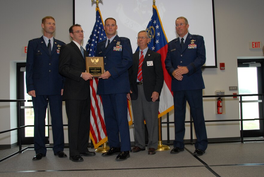 SAVANNAH, Ga. -- Capt. Brian Higgins, 23rd Wing Plans and Programs at Moody Air Force Base, Ga., receives the Outstanding Logistics Achievement Award for the 2009 Georgia Air Force Association Awards here Aug. 29. (Courtesy photo)