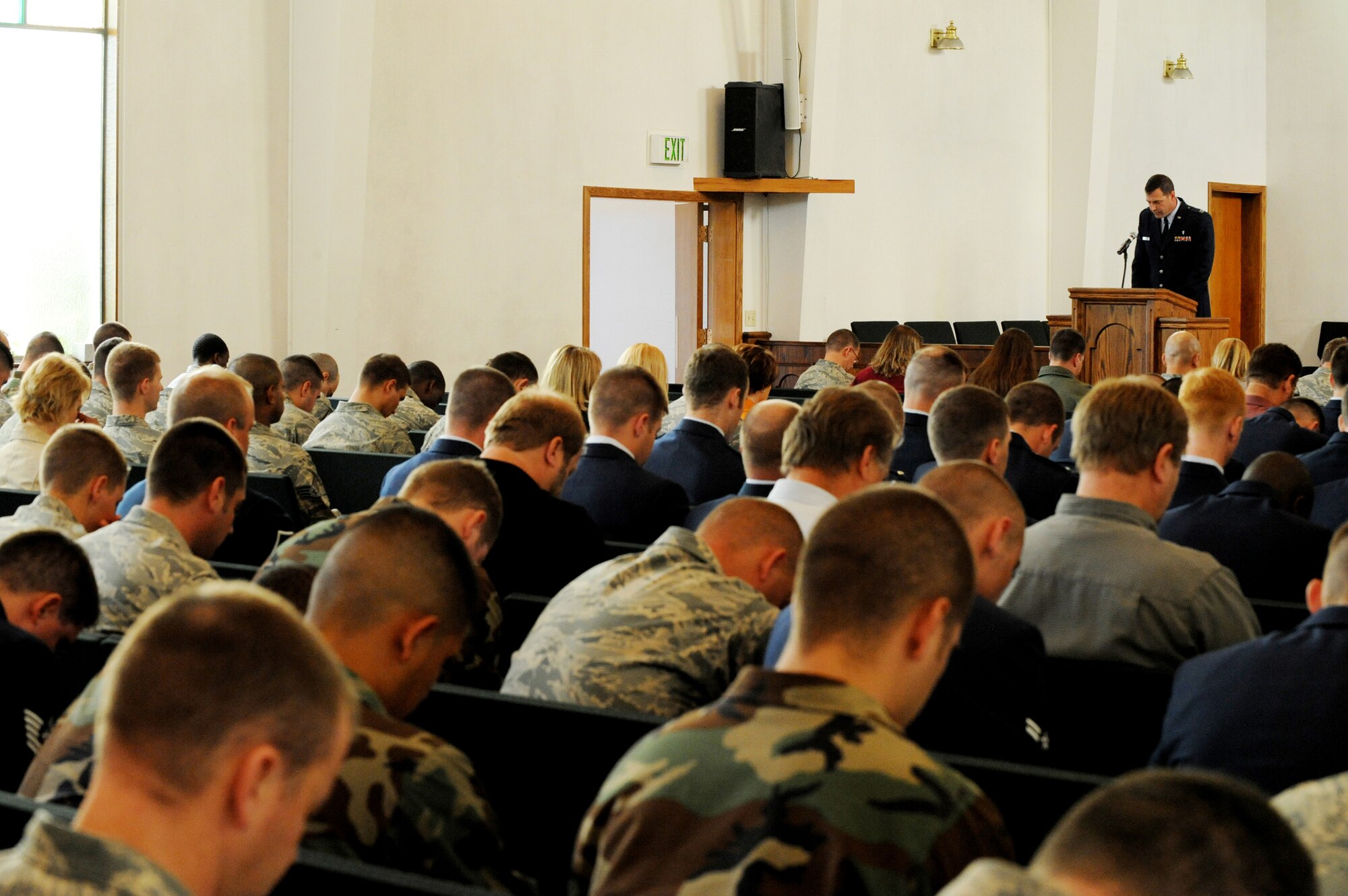 ELMENDORF AIR FORCE BASE, Alaska -- Capt. James Anderson, a 3rd Wing chaplain, leads the congregation in prayer during the memorial of Airman 1st Class Jonathan Fleming, 3rd Civil Engineer Squadron, here Aug. 27. The ceremony, which was open to the base, was held in honor of Fleming who recently passed away from injuries suffered in a vehicle accident. (U.S. Air Force photo/Staff Sgt. Joshua Garcia)