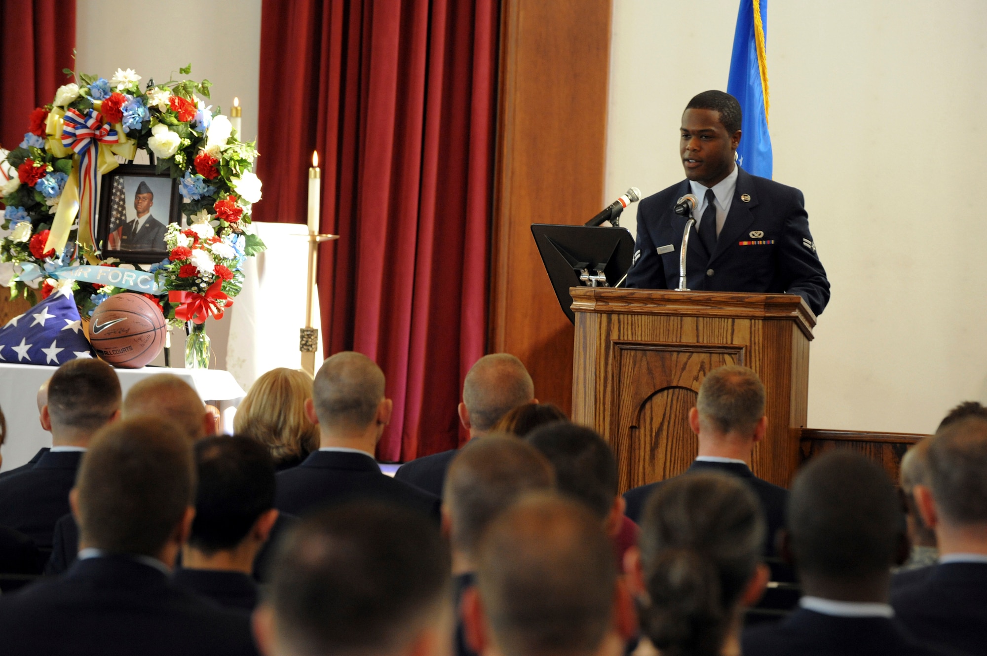 ELMENDORF AIR FORCE BASE, Alaska -- Airman 1st Class Travis Barnwell, 3rd Civil Engineer Squadron, tells memorial service attendees of how he first met friend, Airman 1st Class Jonathan Fleming, 3rd CES, here Aug. 27. The ceremony, which was open to the base, was held in honor of Fleming who recently passed away from injuries suffered in a vehicle accident. (U.S. Air Force photo/Staff Sgt. Joshua Garcia)