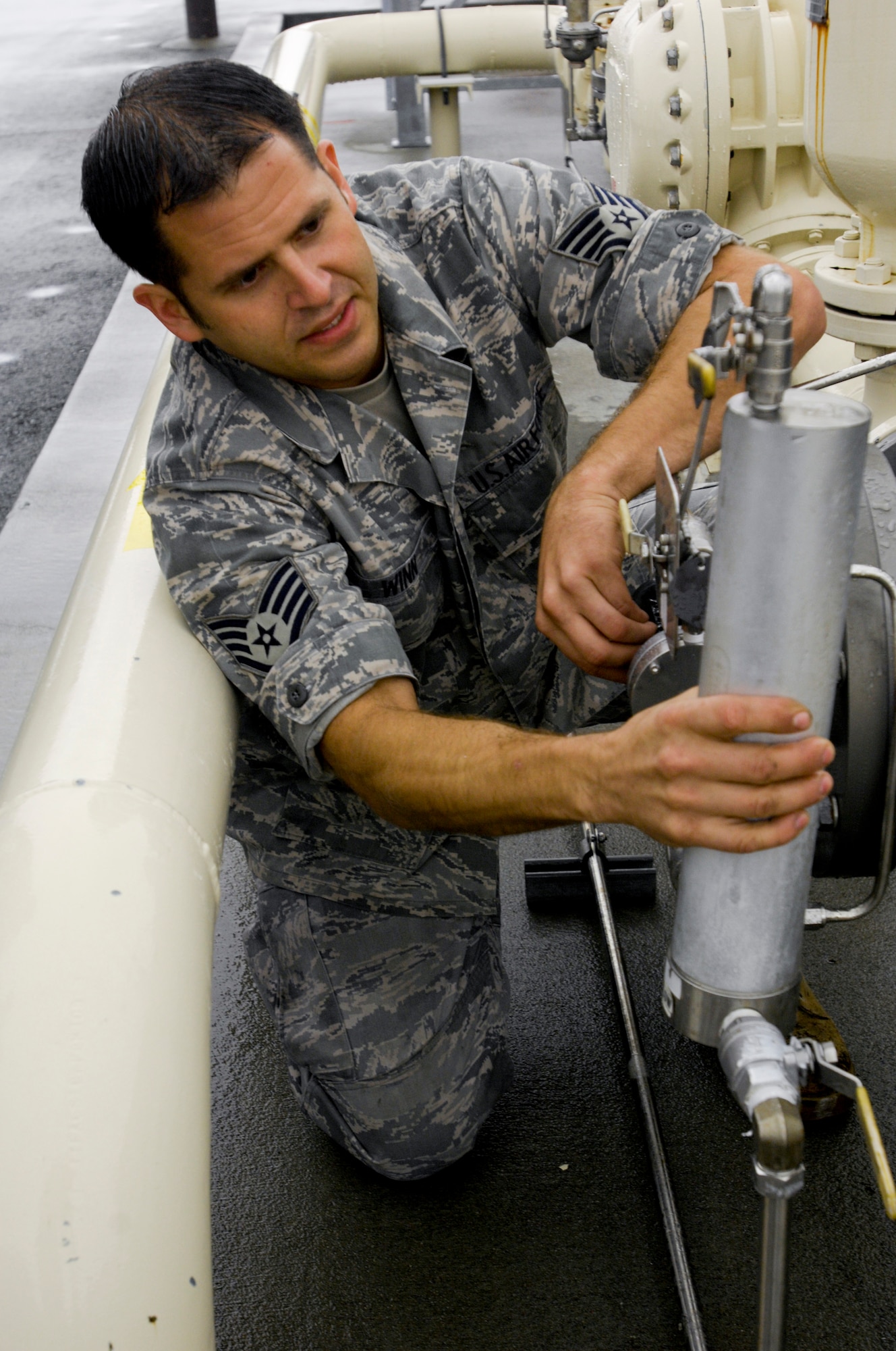 ELMENDORF AIR FORCE BASE, Alaska -- Staff Sgt. Jesse Winn, 3rd Logistics Readiness Squadron, regulates the amount of Plus 100 being blended into the JP-8 aviation fuel. Elmendorf began the using  Plus 100 additive in their JP-8 aviation fuel Sept. 1. The additive helps prevent buildup in F-15 Eagle and F-22 Raptor engines; therefore it will reduce the amount of maintenance needed on those engines.   (U.S. Air Force photo/Airman 1st Class Christopher Gross)